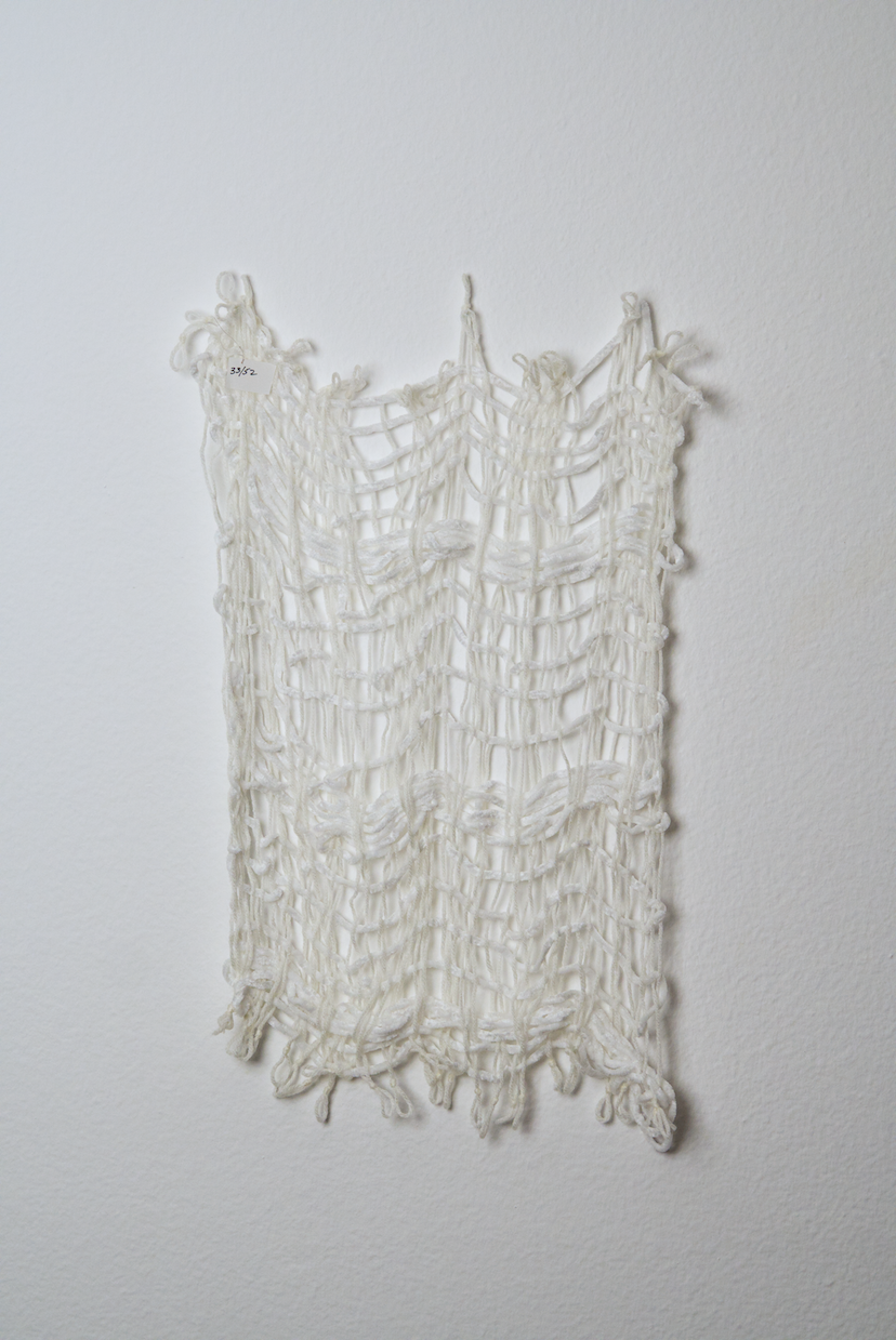 Neutral shades of white, tan, gold, brown, black and orange yarn to provide a visual record of the shift in feelings from week to week over the course of one year.