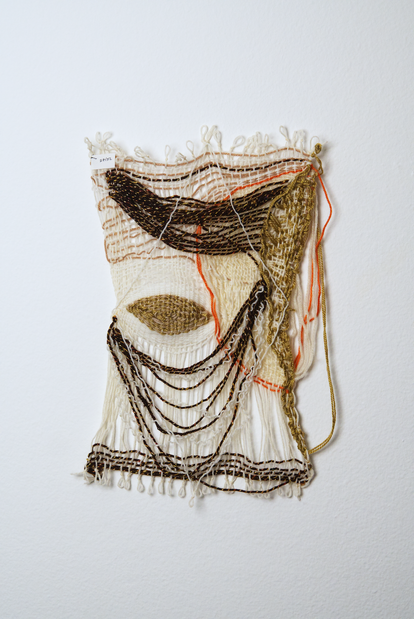 Neutral shades of white, tan, gold, brown, black and orange yarn to provide a visual record of the shift in feelings from week to week over the course of one year.