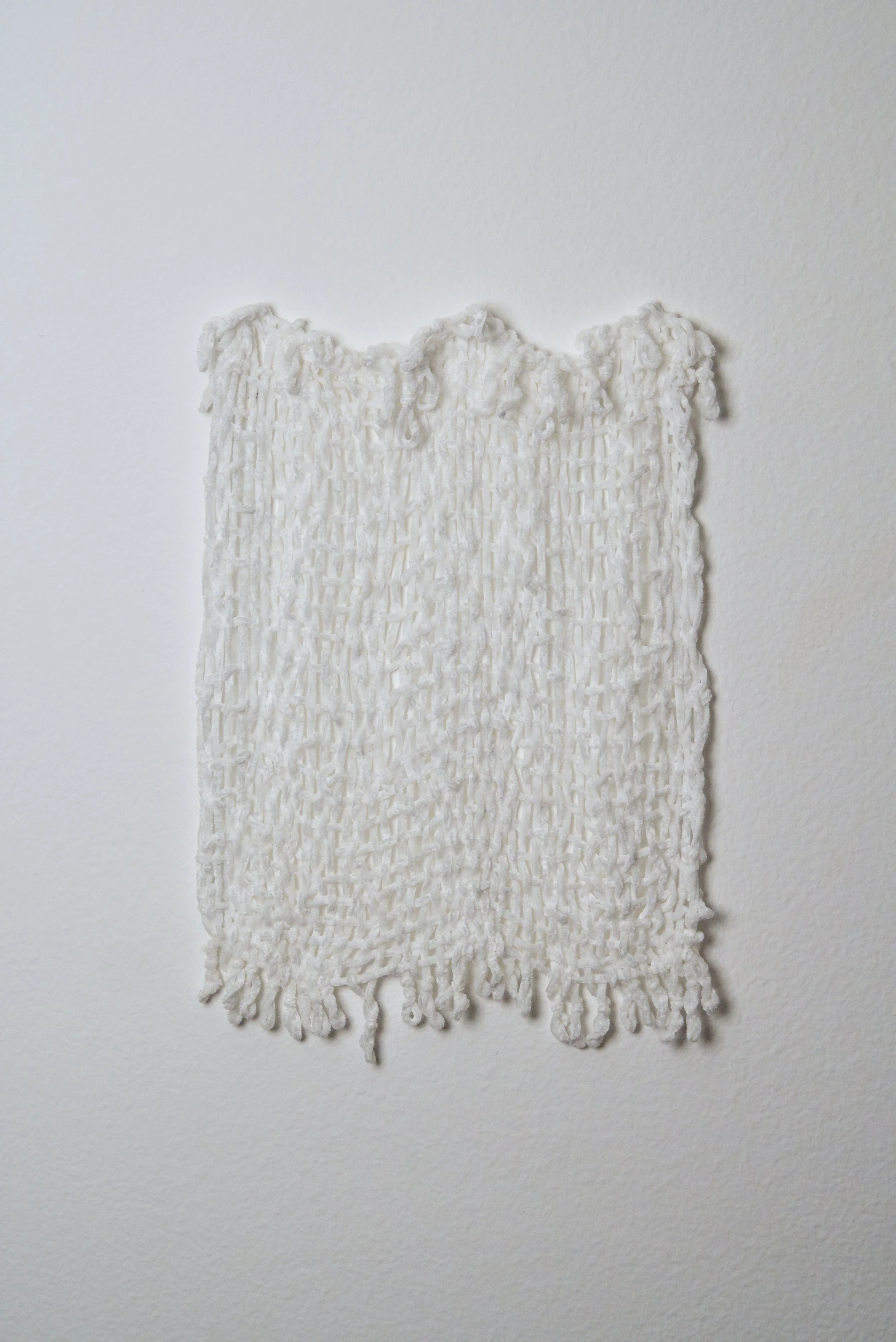 Relatively Permanent 49/52 
approximately 14" x 18",   yarn, 2024. 