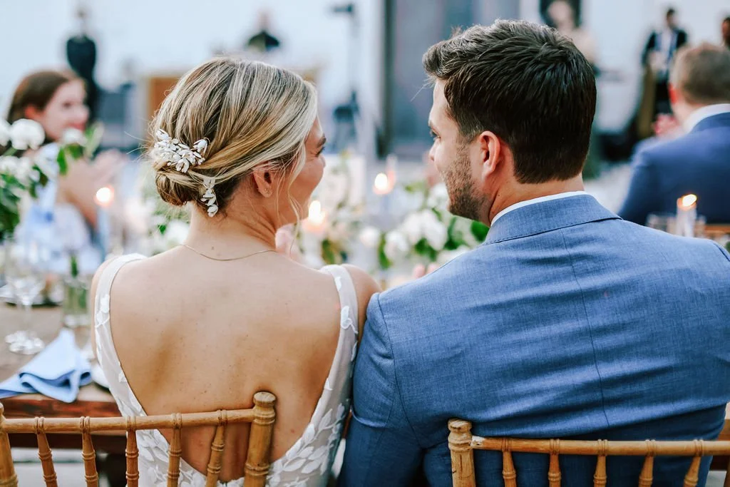 Bride and groom smiling during their reception at their Brooklyn Botanic Garden wedding