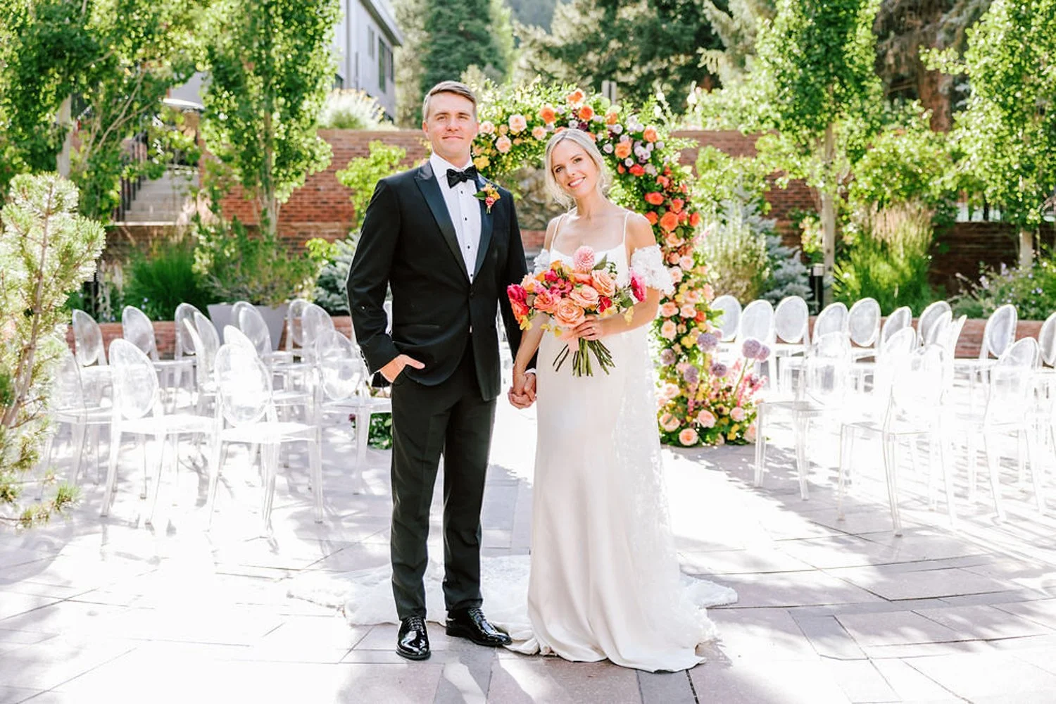 bride and groom smiling on their wedding day at the st regis aspen resport in aspen, colorado