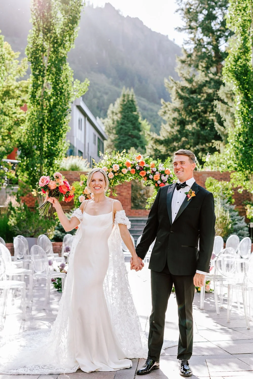 bride and groom smiling on their wedding day at the st regis in aspen, colorado