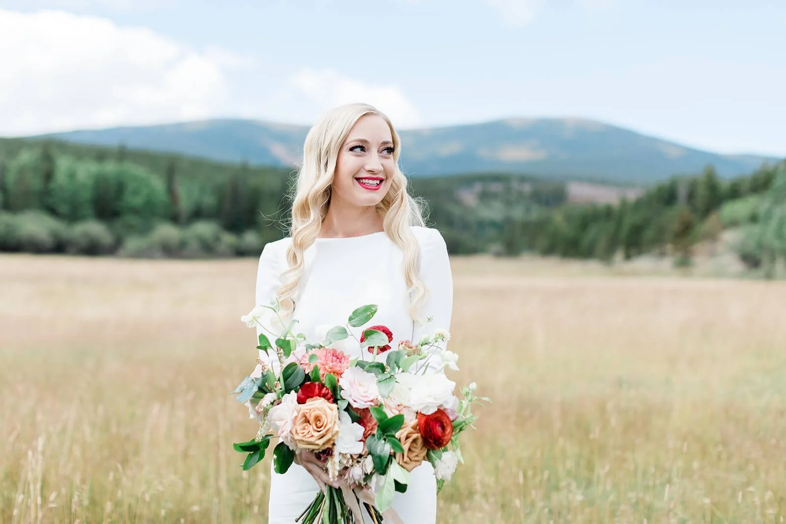 bride smiling on her wedding day at caribour ranch in colorado