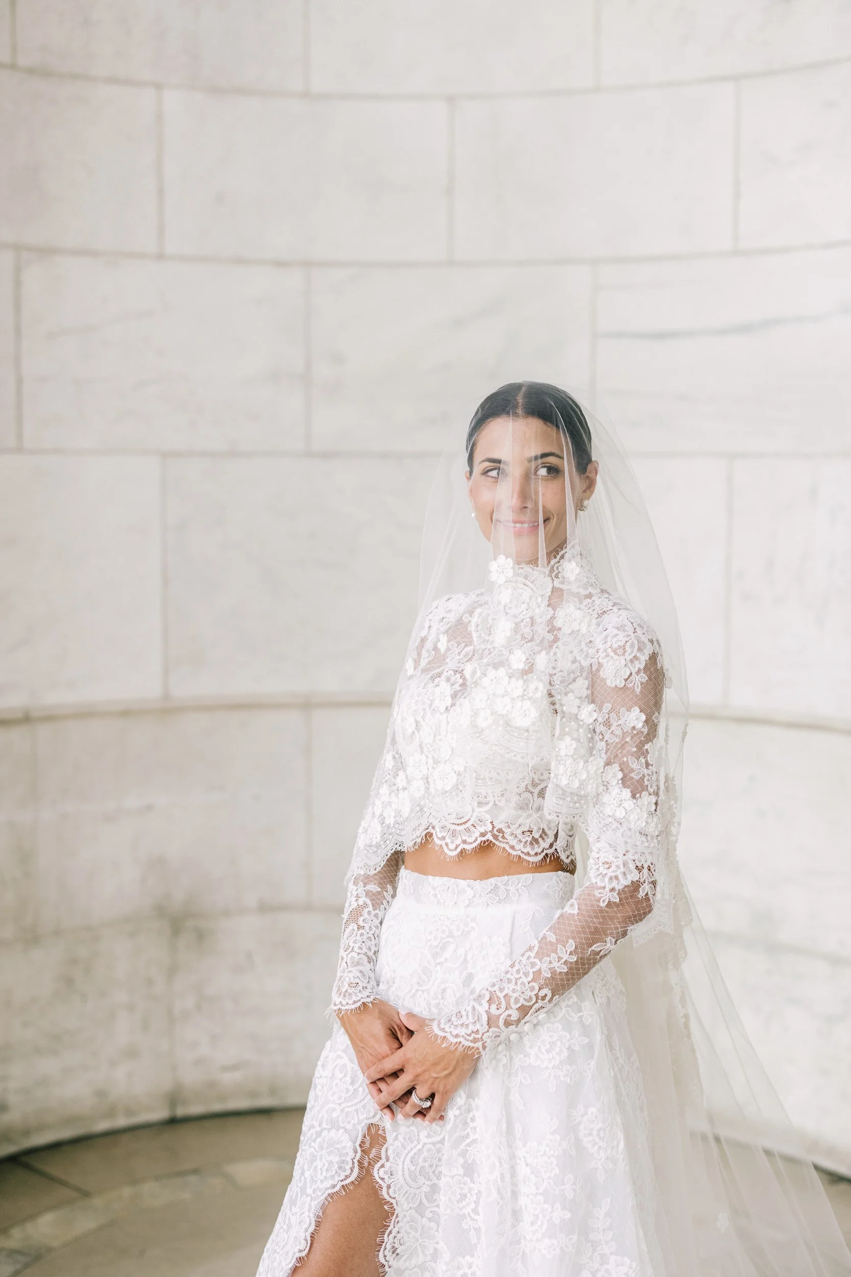 Bridal portrait of bride in her elegant lace wedding gown at the New York Public Library, NYC wedding