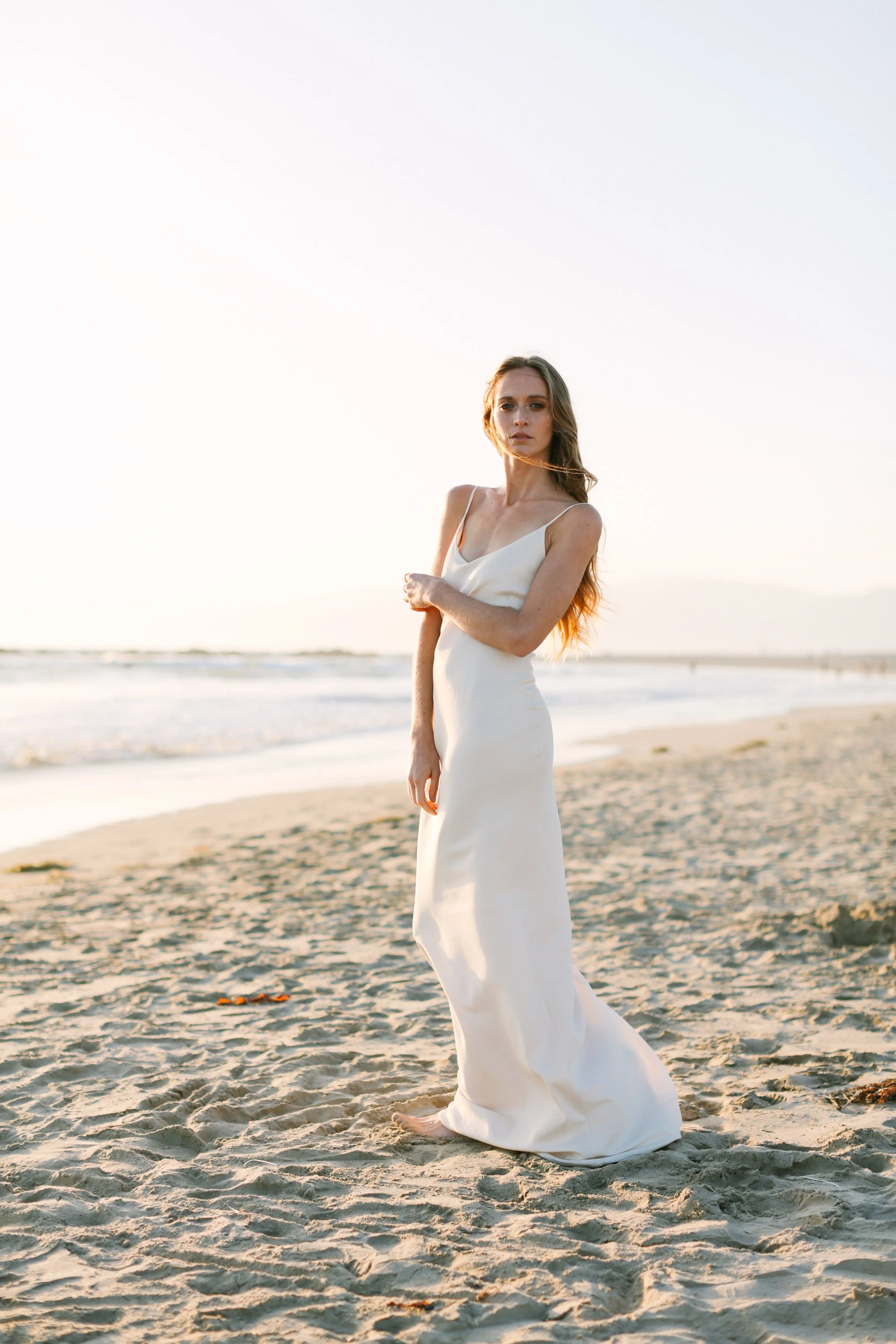 Actor headshot of a woman in a white dress on the beach photographed by Denver headshot photographer Betsi Ewing