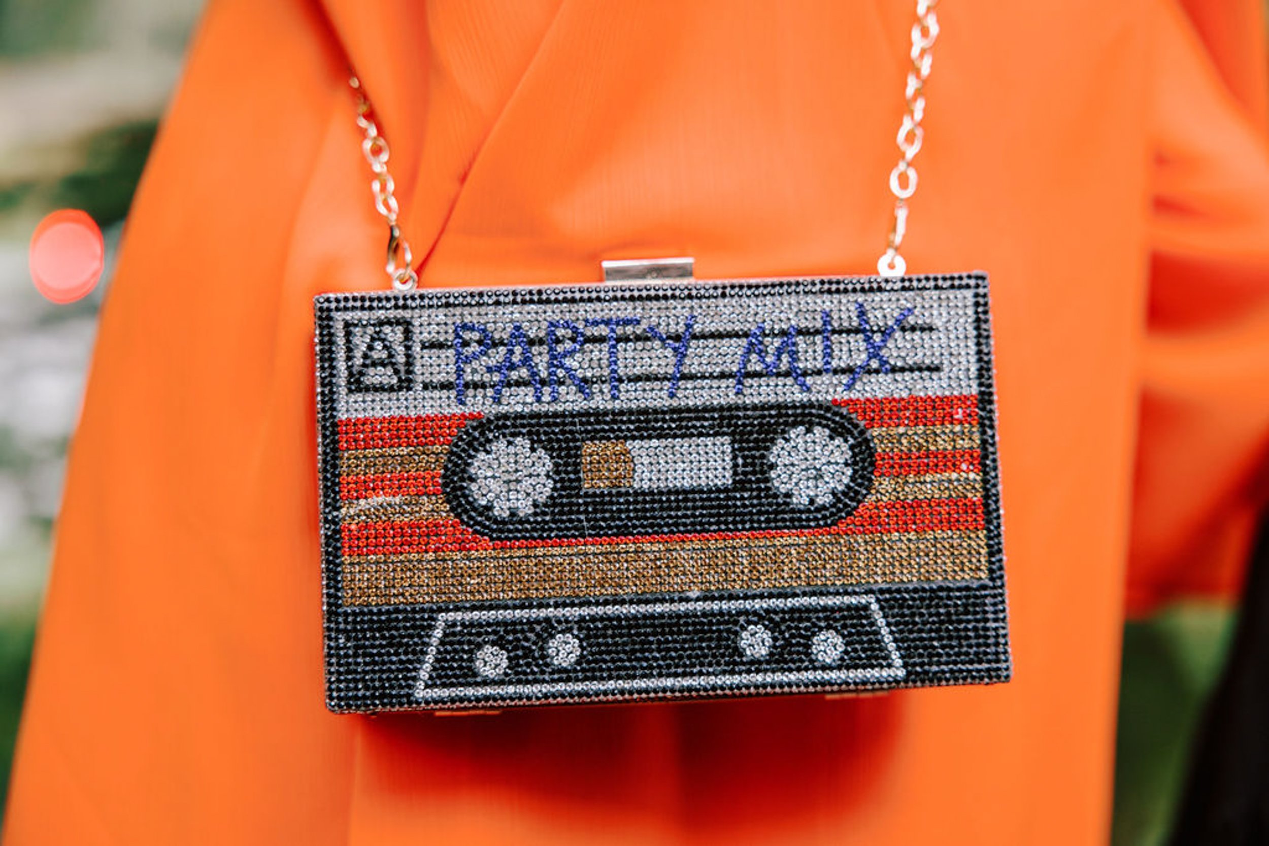 Rhinestone cassette tape clutch purse wedding guest accessory detail at Pine Creek Cookhouse rodeo disco wedding in Aspen Colorado