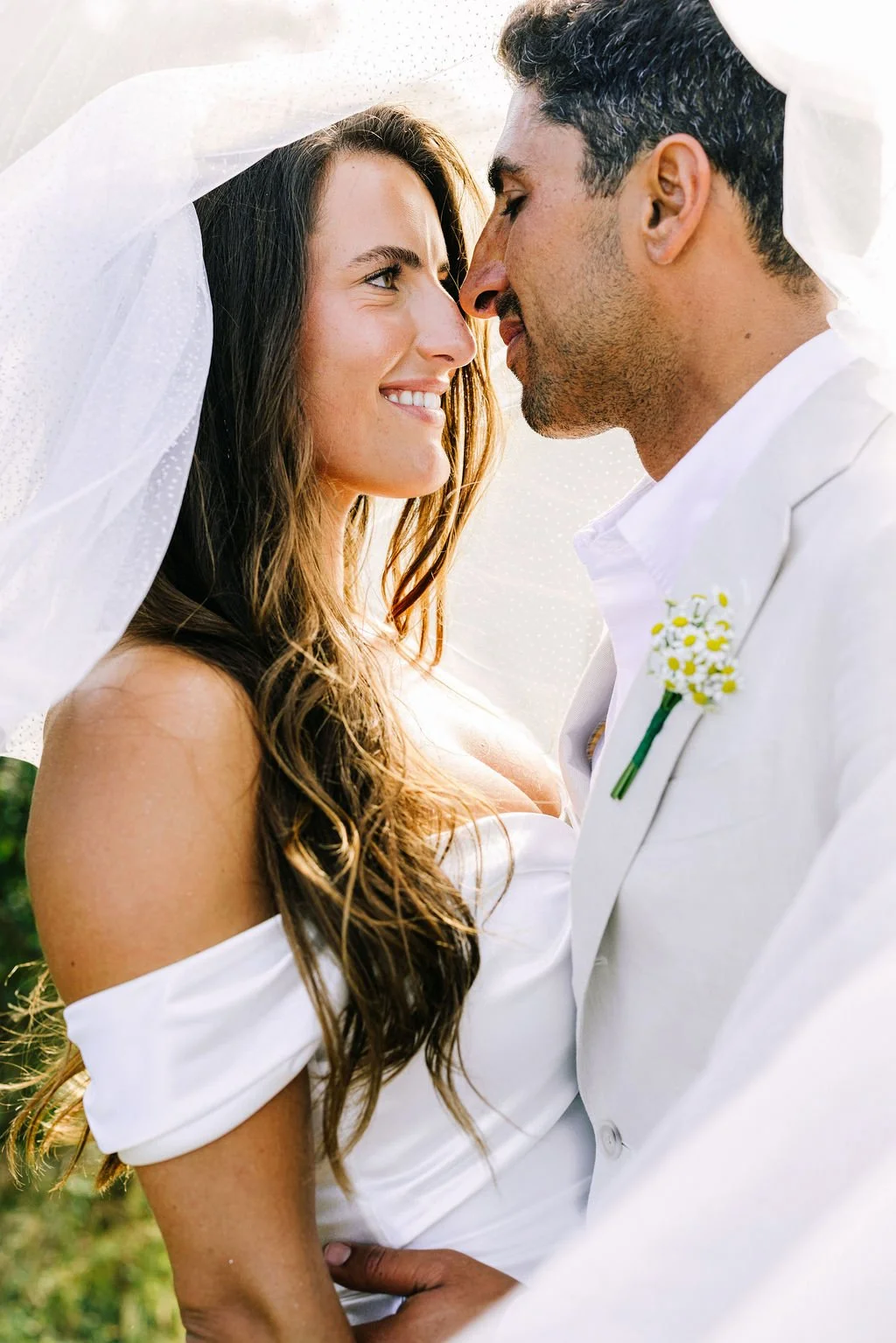bride and groom during a romantic moment on their wedding day in montauk, new york