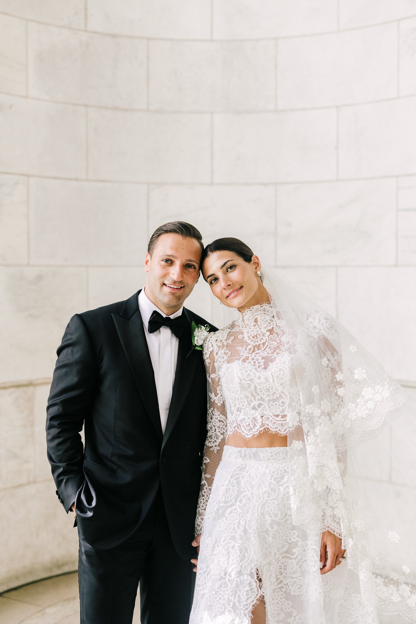 Close-up portrait of bride and groom posing together at the New York Public Library, NYC wedding