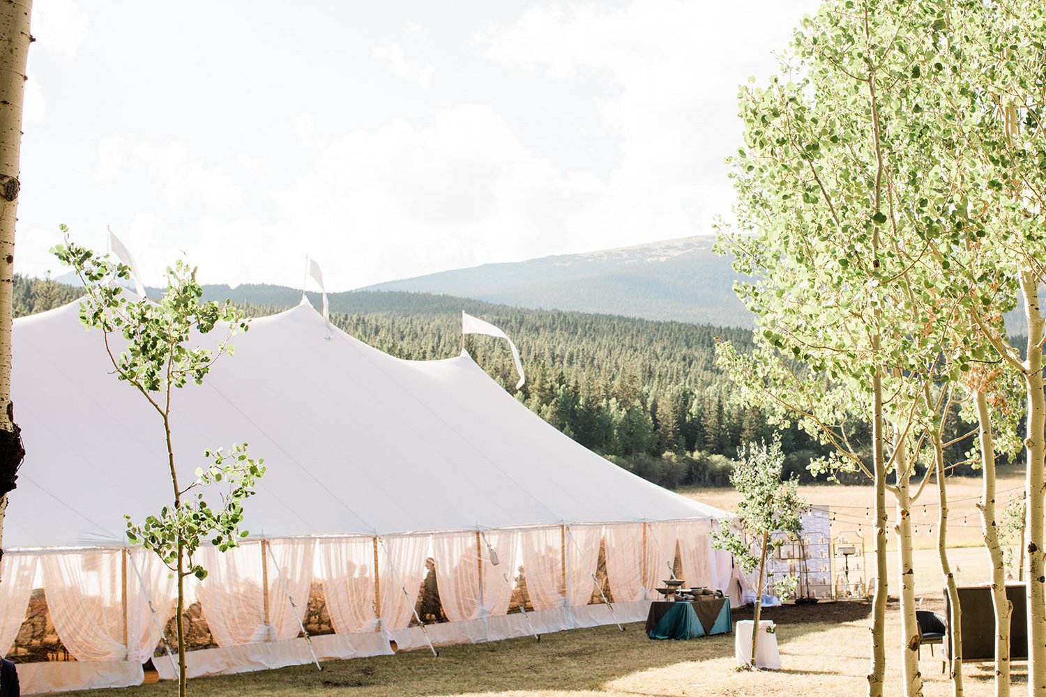 photo of an outdoor tented wedding reception in vail, colorado