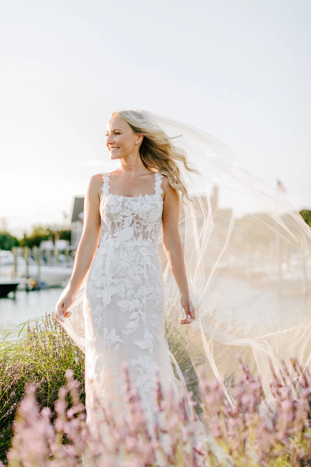 Bride smiling during golden hour portraits at Peconic Bay Yacht Club wedding on the North Fork of Long Island
