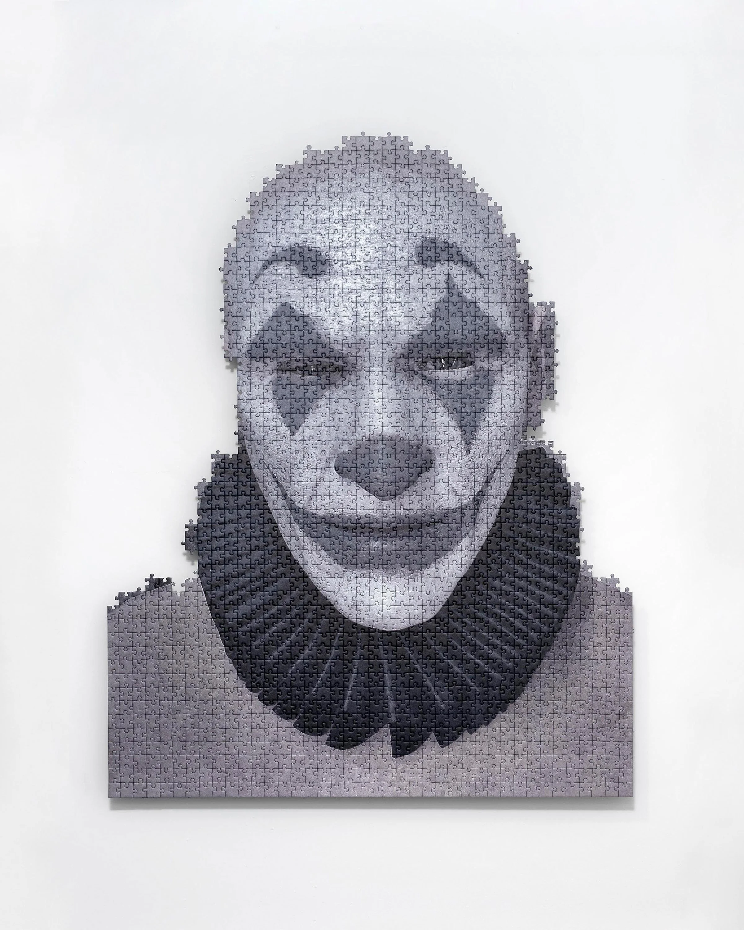 DER MANN DER LACHT, 2022
digital print on puzzle, aluminium 
construction
94,5 x 75,5 x 5,5 cm