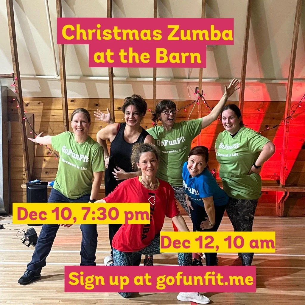 Group of five women participating in a Christmas-themed Zumba class at a barn, with some wearing green and one wearing red, and promotional text overlay about the event dates and sign-up website.