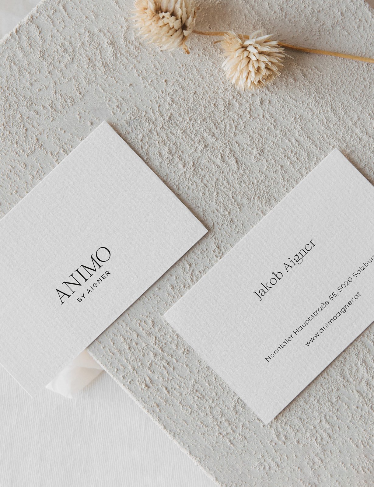 Visitenkarten von ANIMO by Aigner im abgestimmten Corporate Design