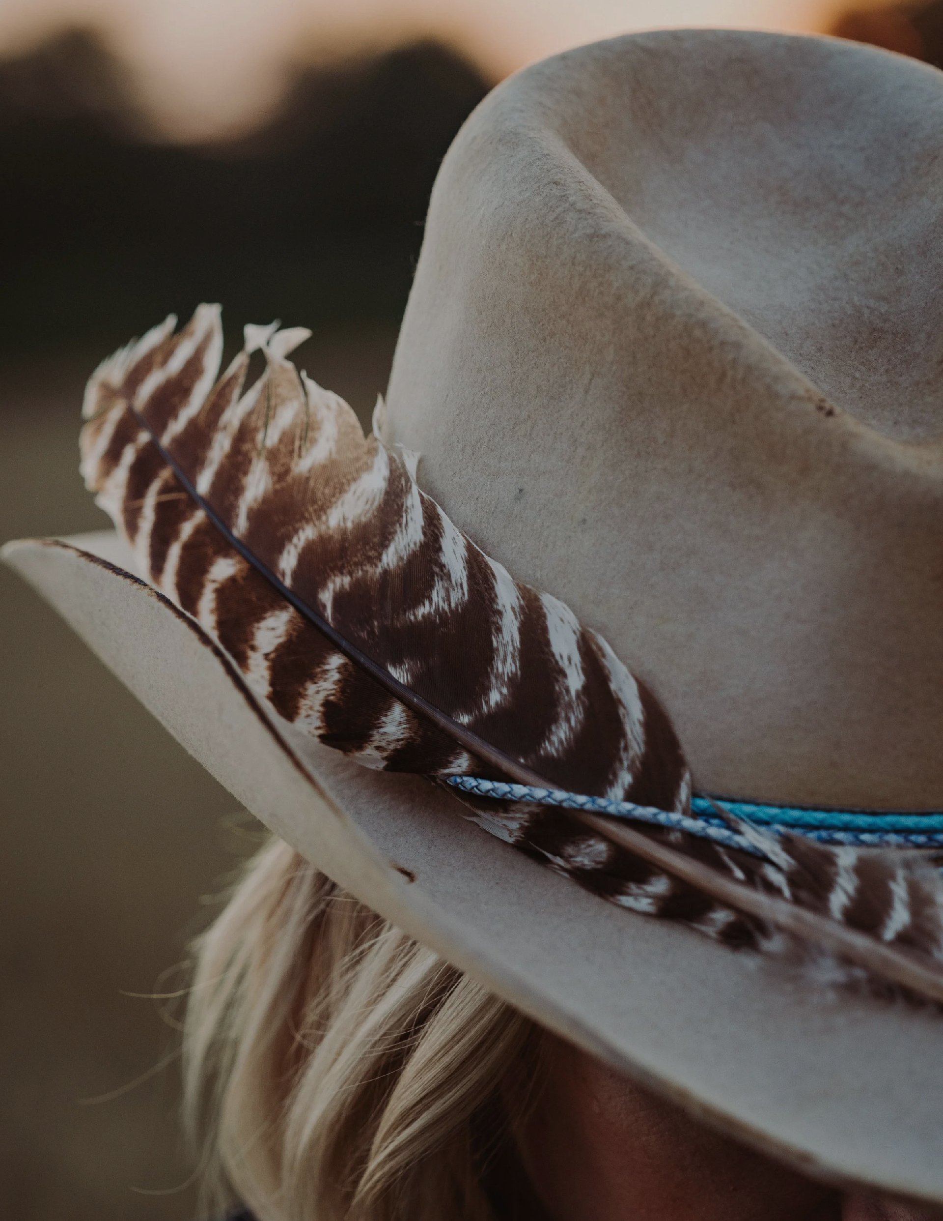 A woman wearing a tan custom hat by Nic & Maude