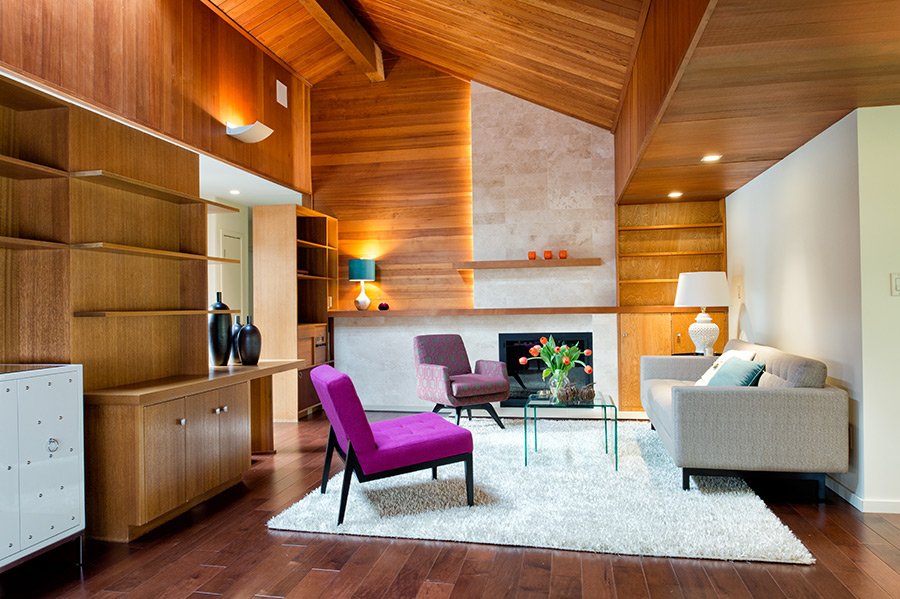 living room with wood features and mid-century modern furniture