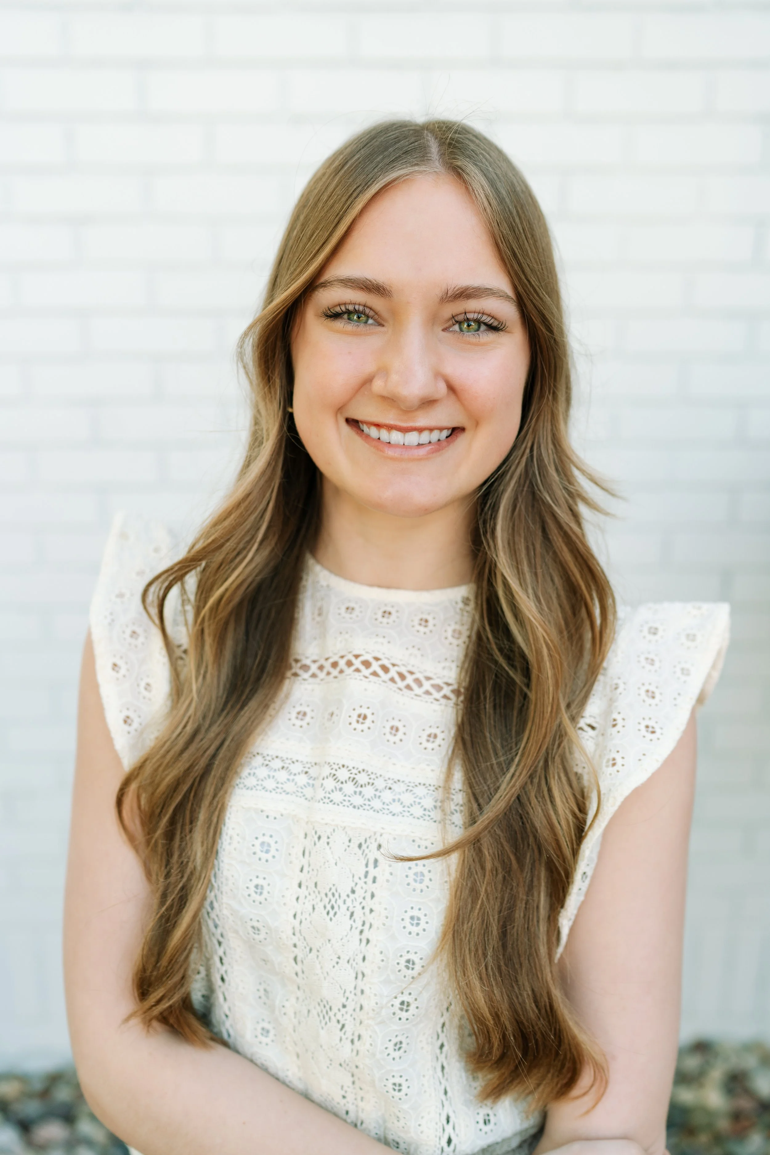 Dawnsyn is a woman with long blonde hair in a white sweater