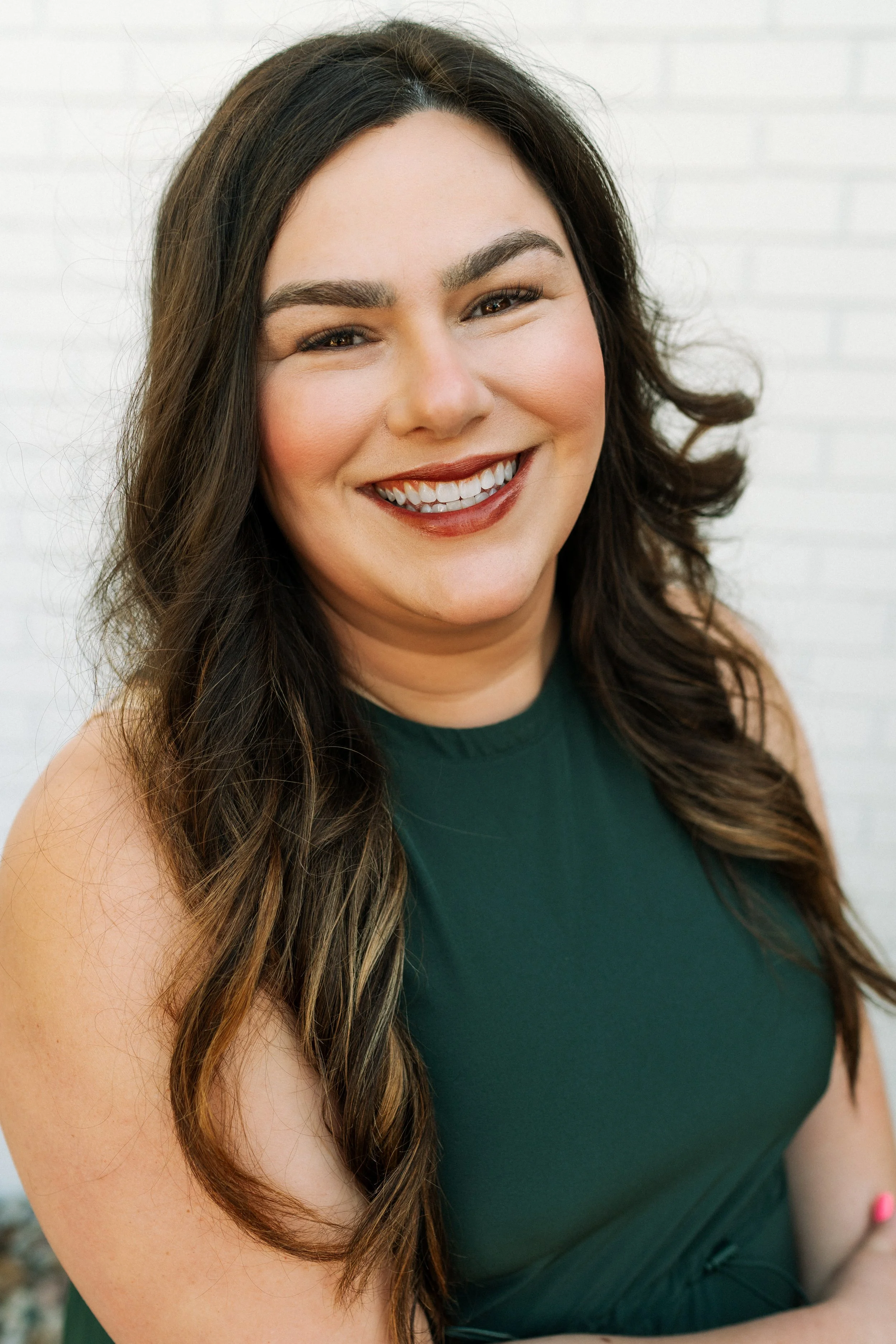 Dr. McIntyre is a woman with long, dark hair and a blue shirt