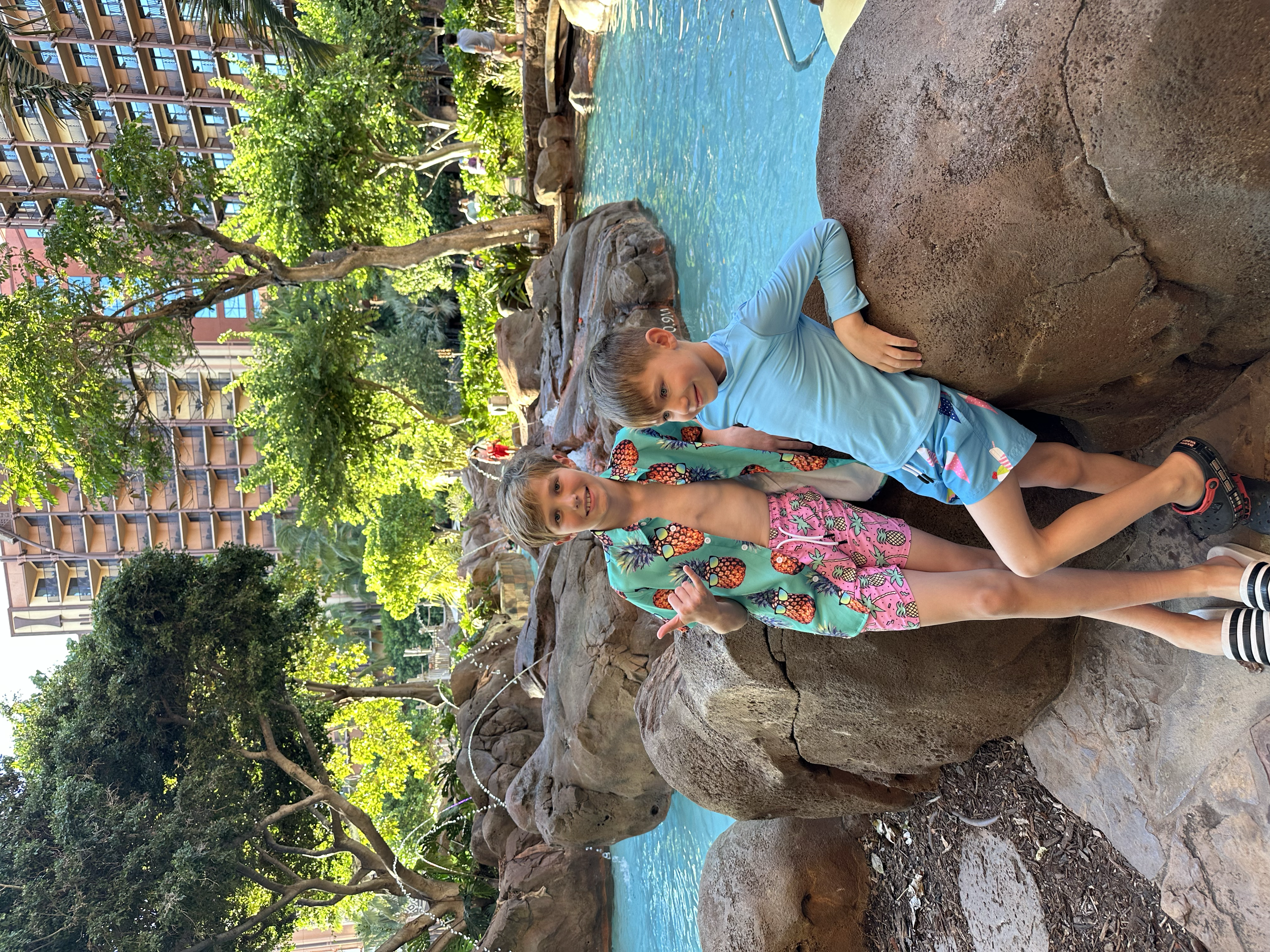 two boys next to pools