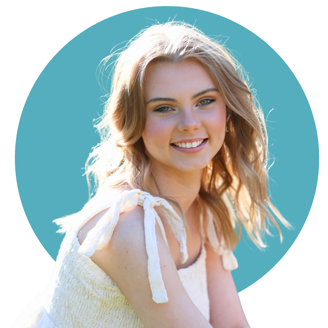 girl in a white dress with shoulder length brown hair