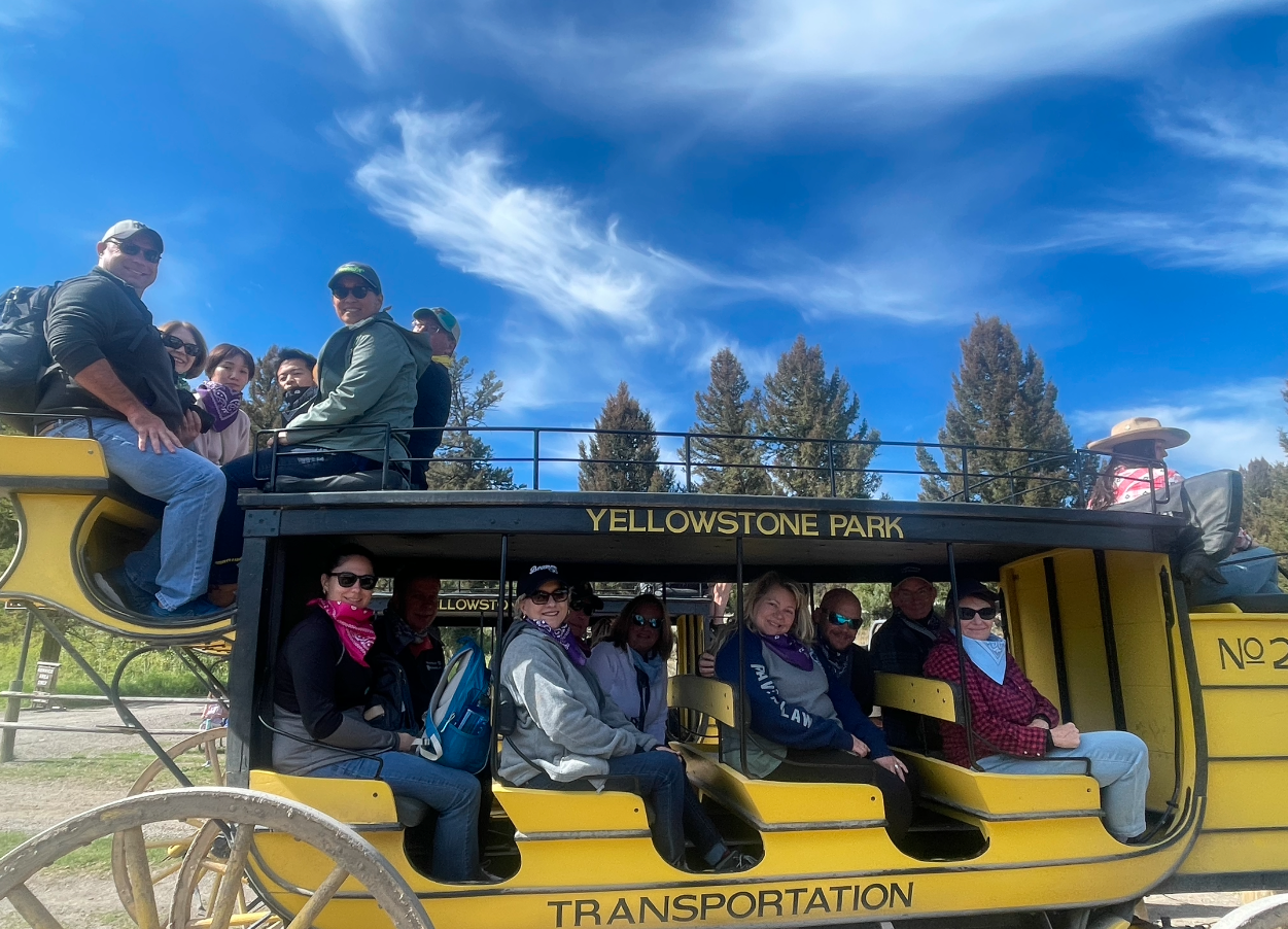 a big group of people in in a yellow carriage