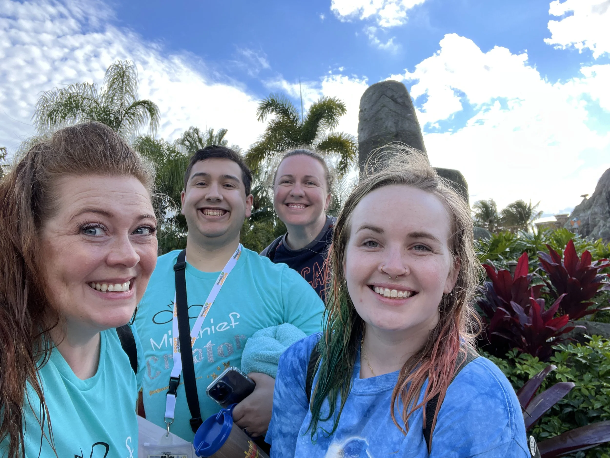 Noddea and three fellow advisors smiling in a sunny group selfie during a 2022 Goofy Getaways training trip in Orlando.