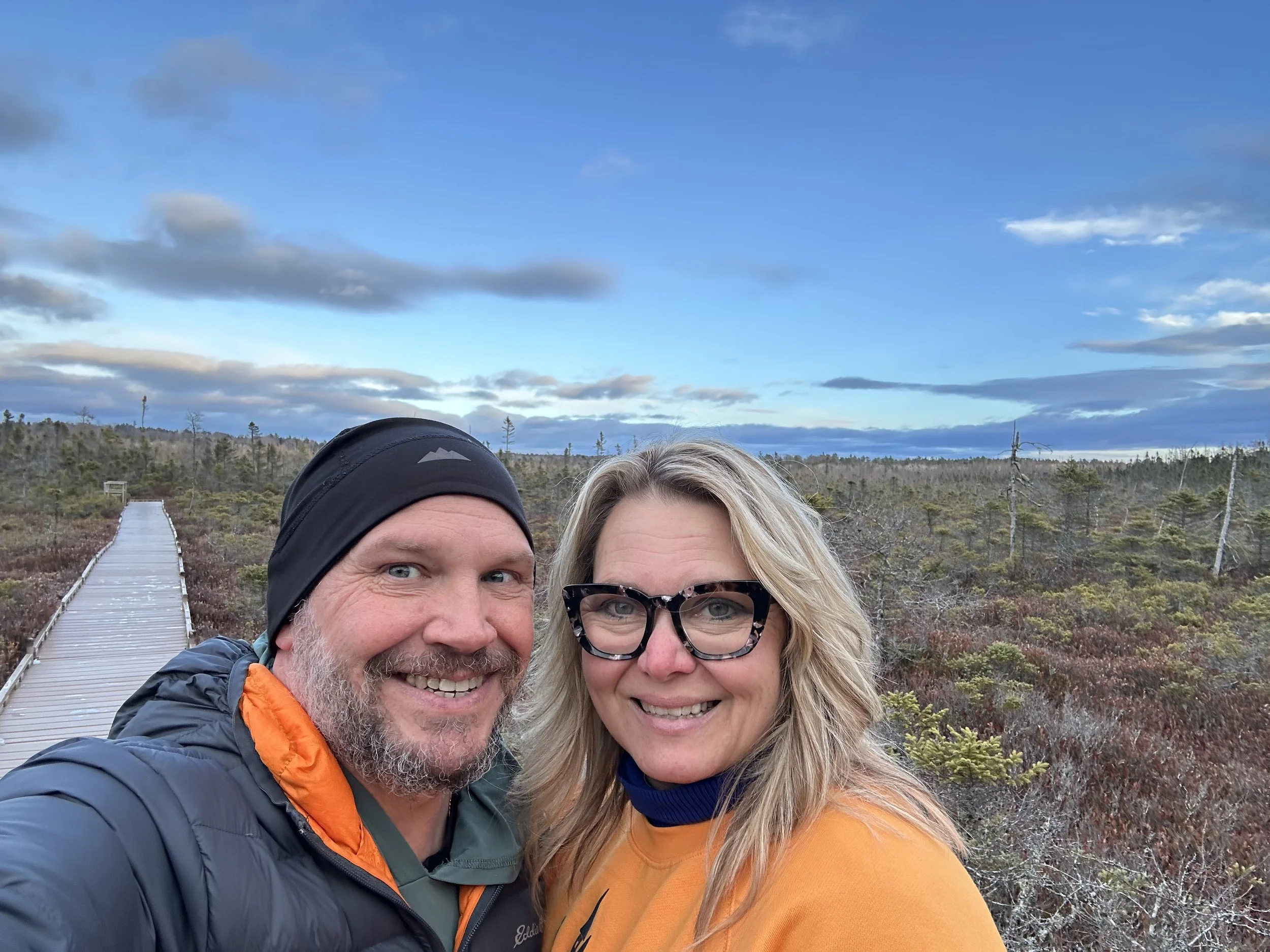 couple standing out in a nature park