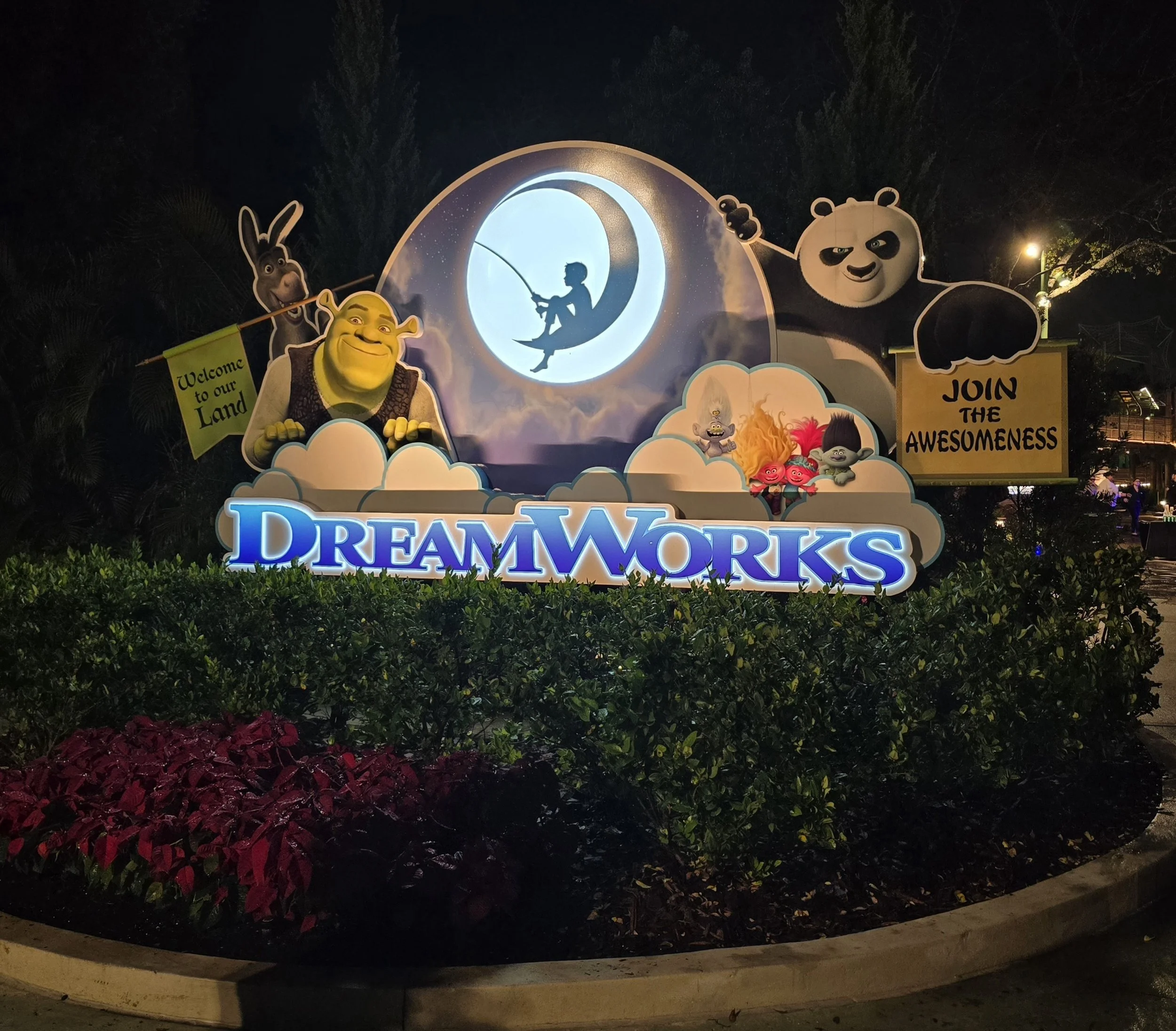 DreamWorks logo with other charters on a sign