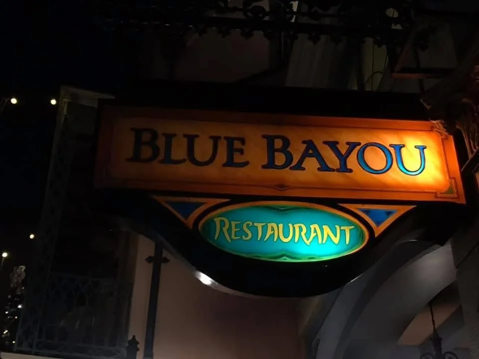 a sign that reads blue bayou restaurant