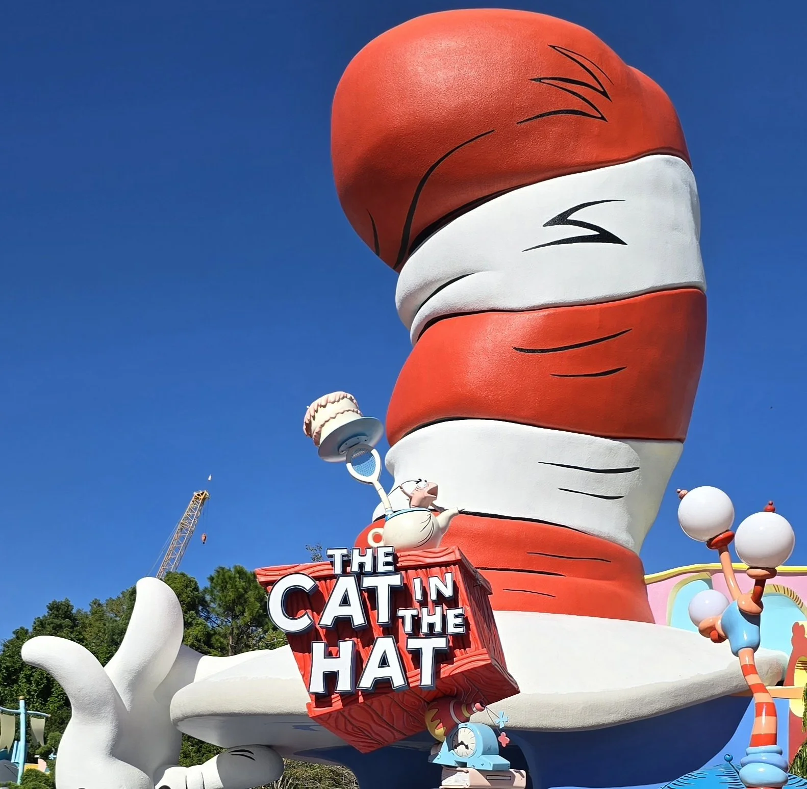 a large red and white hat on top of a building