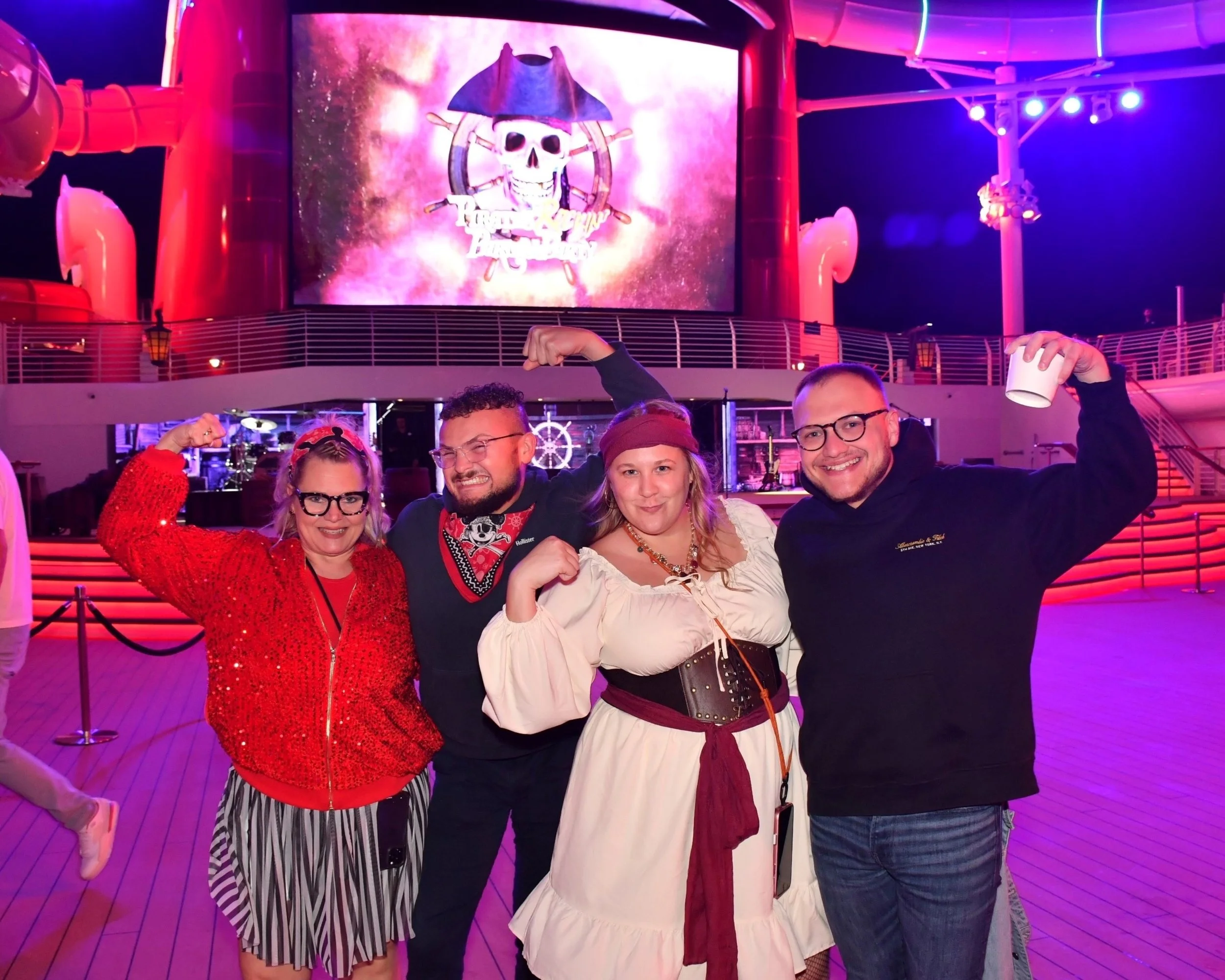 group of people enjoying pirate night on disney cruise line
