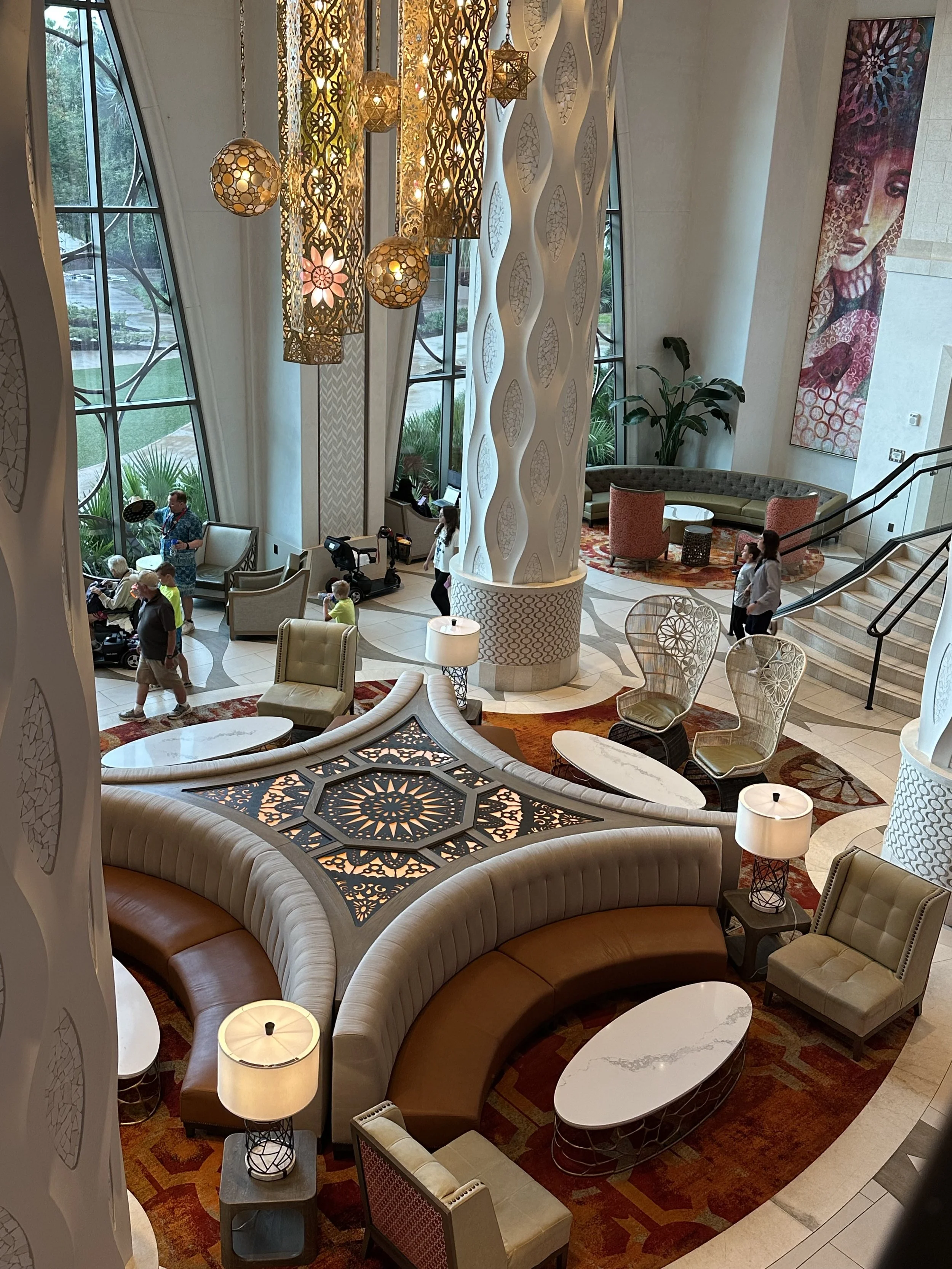 a hotel lobby with white and orange accents