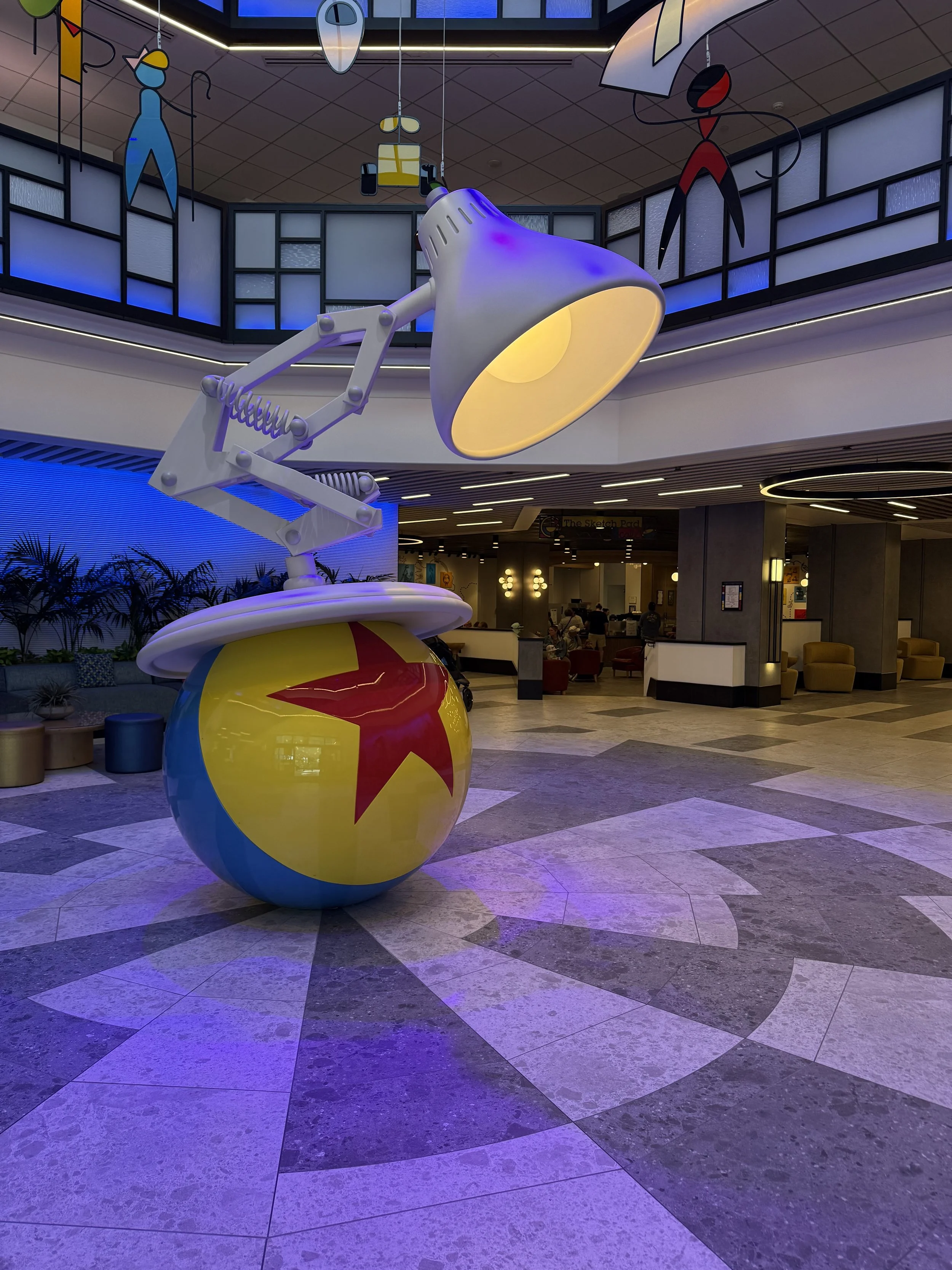 a lamp on top of a ball in a hotel lobby