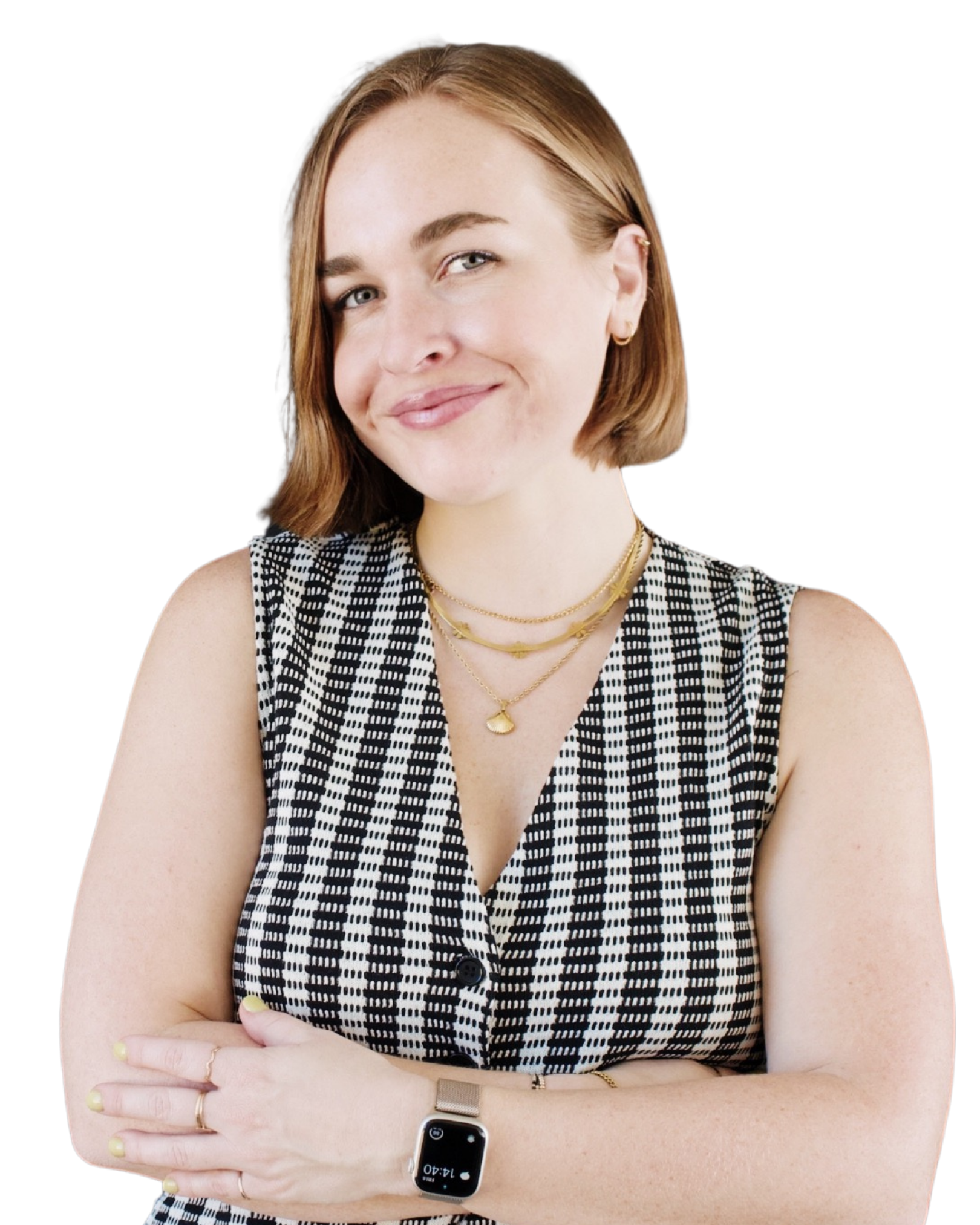 Therapist Emilee smiling with her arms crossed. She has short light brown hair & is wearing a sleeveless checkered dress, gold jewelry, & a smartwatch against a black background.