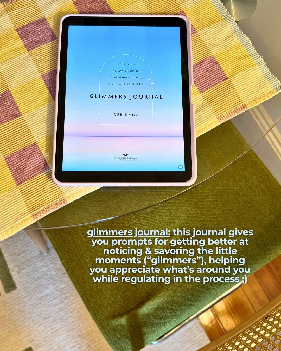 iPad showing the cover of the Glimmers Journal by Deb Dana on a yellow plaid placemat