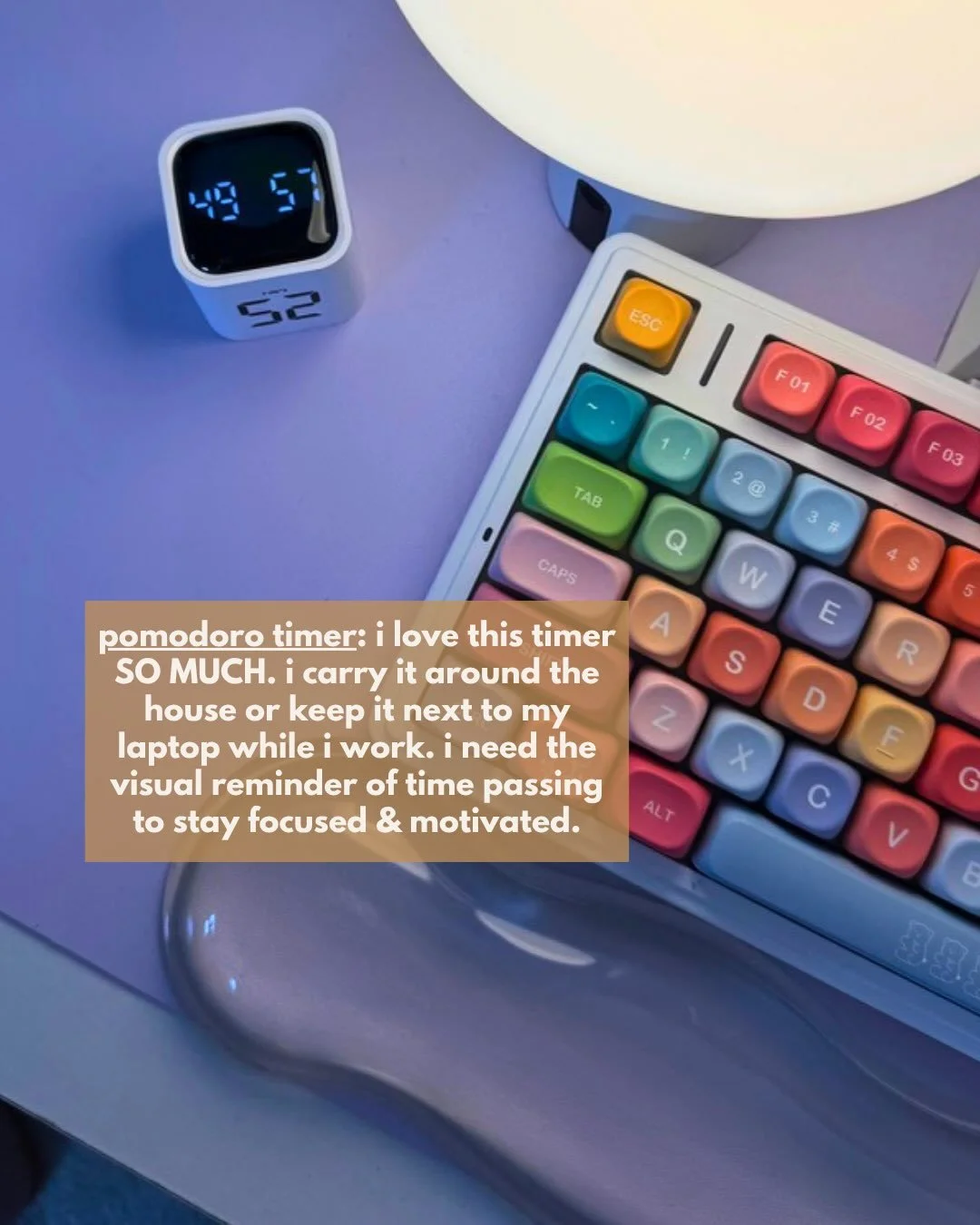 Small rotating Pomodoro timer next to a colorful keyboard
