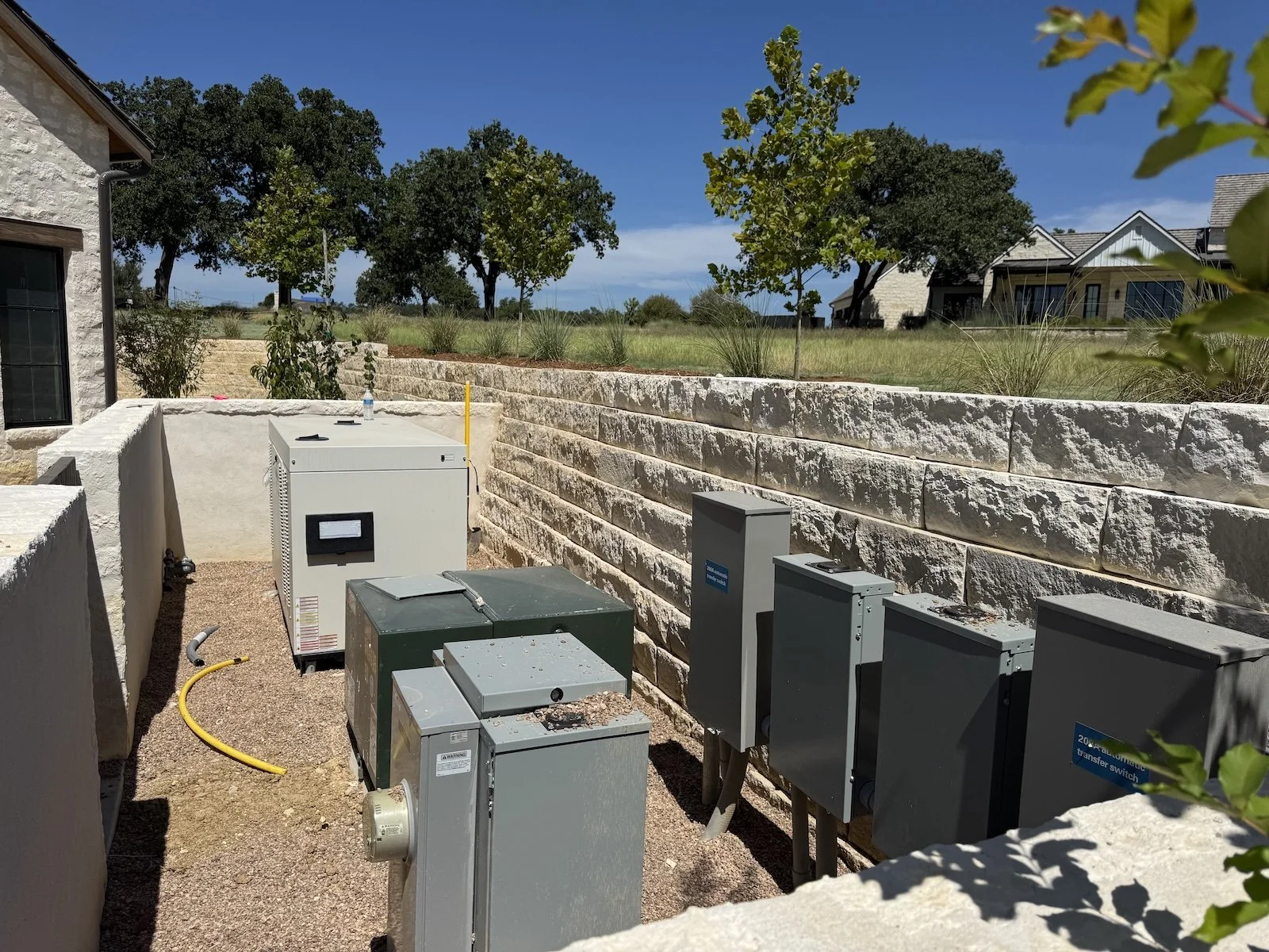 Standby generator, automatic transfer switches, and related exterior electrical equipment