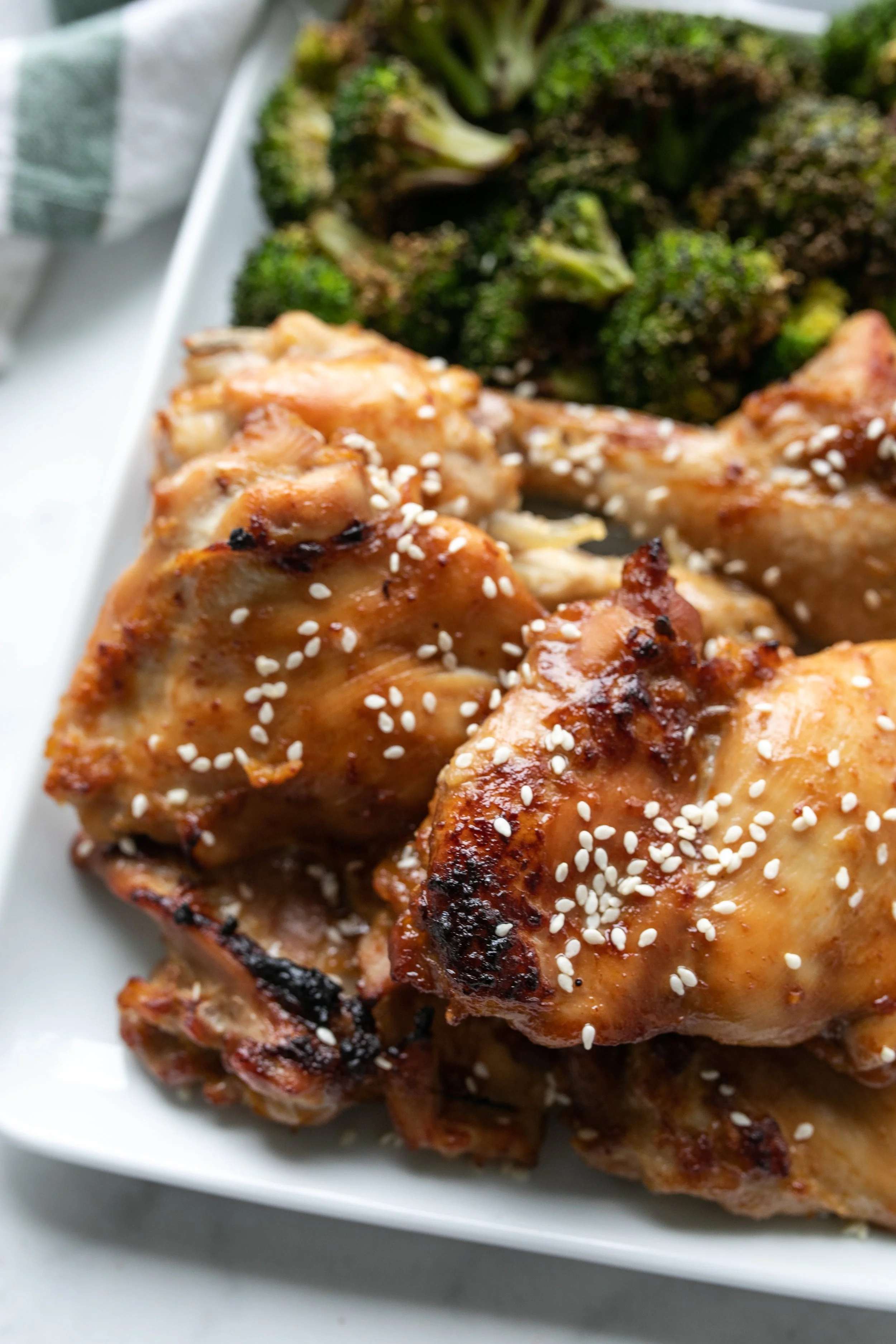 A plate of miso maple chicken thighs for a healthy dinner or lunch.