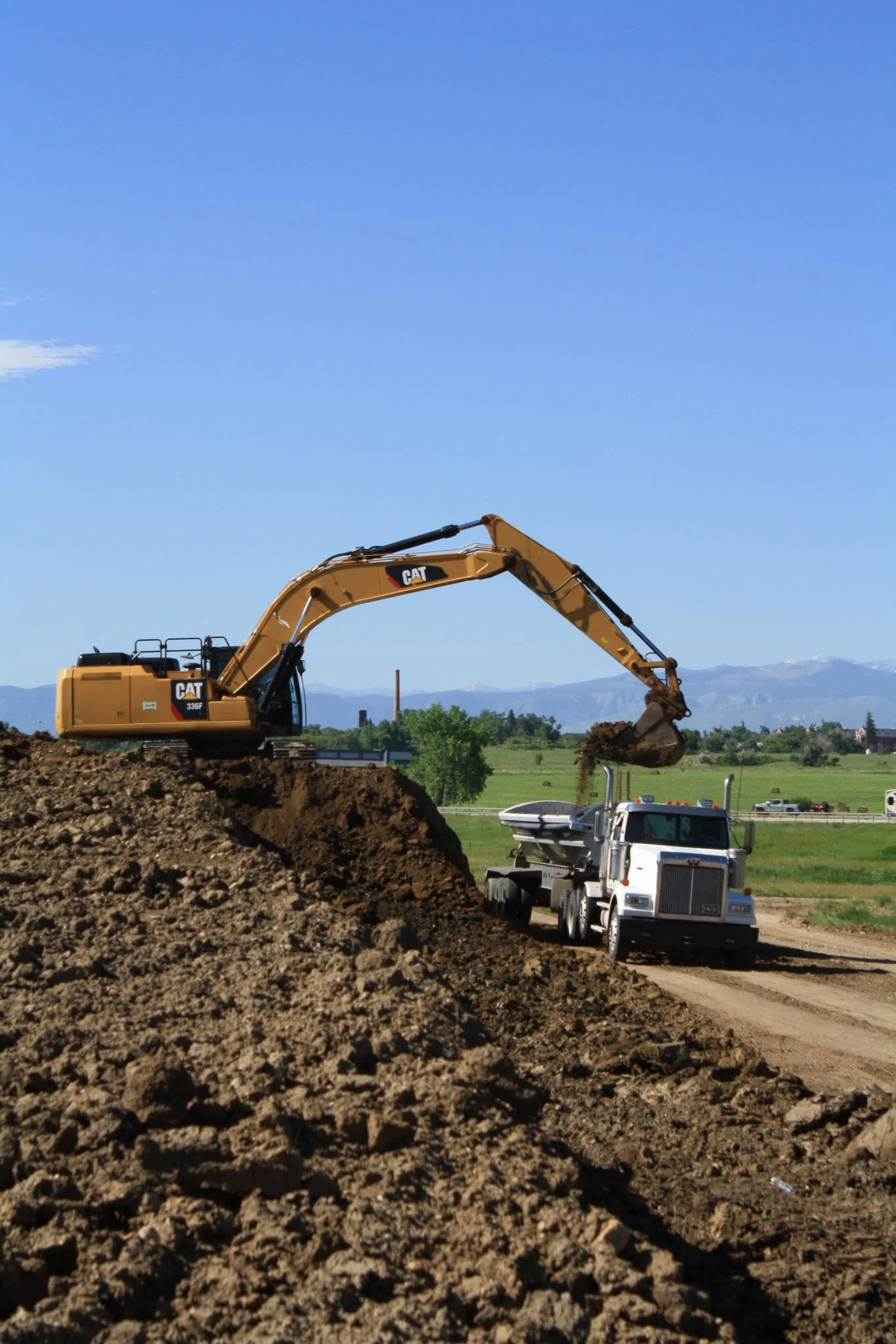 excavator filling dumpster-1.jpg