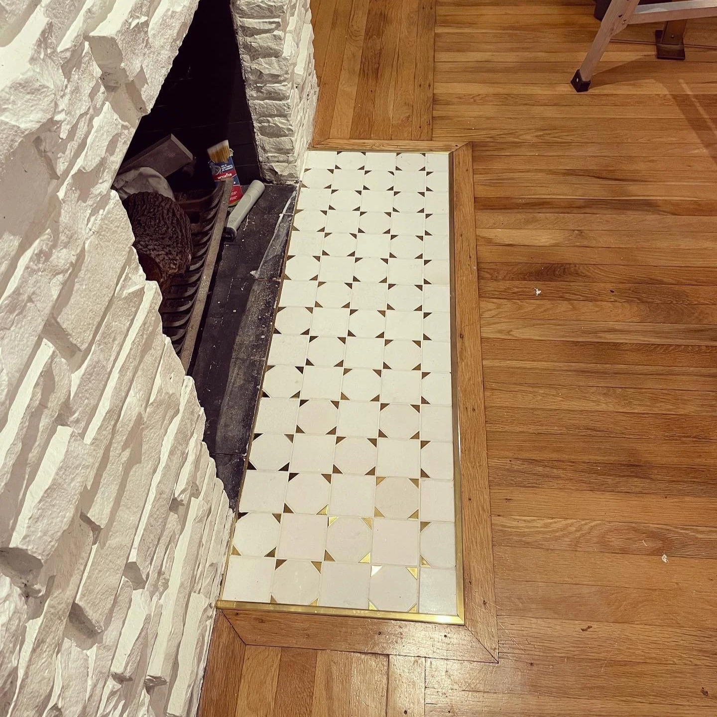Custom gold fireplace tile