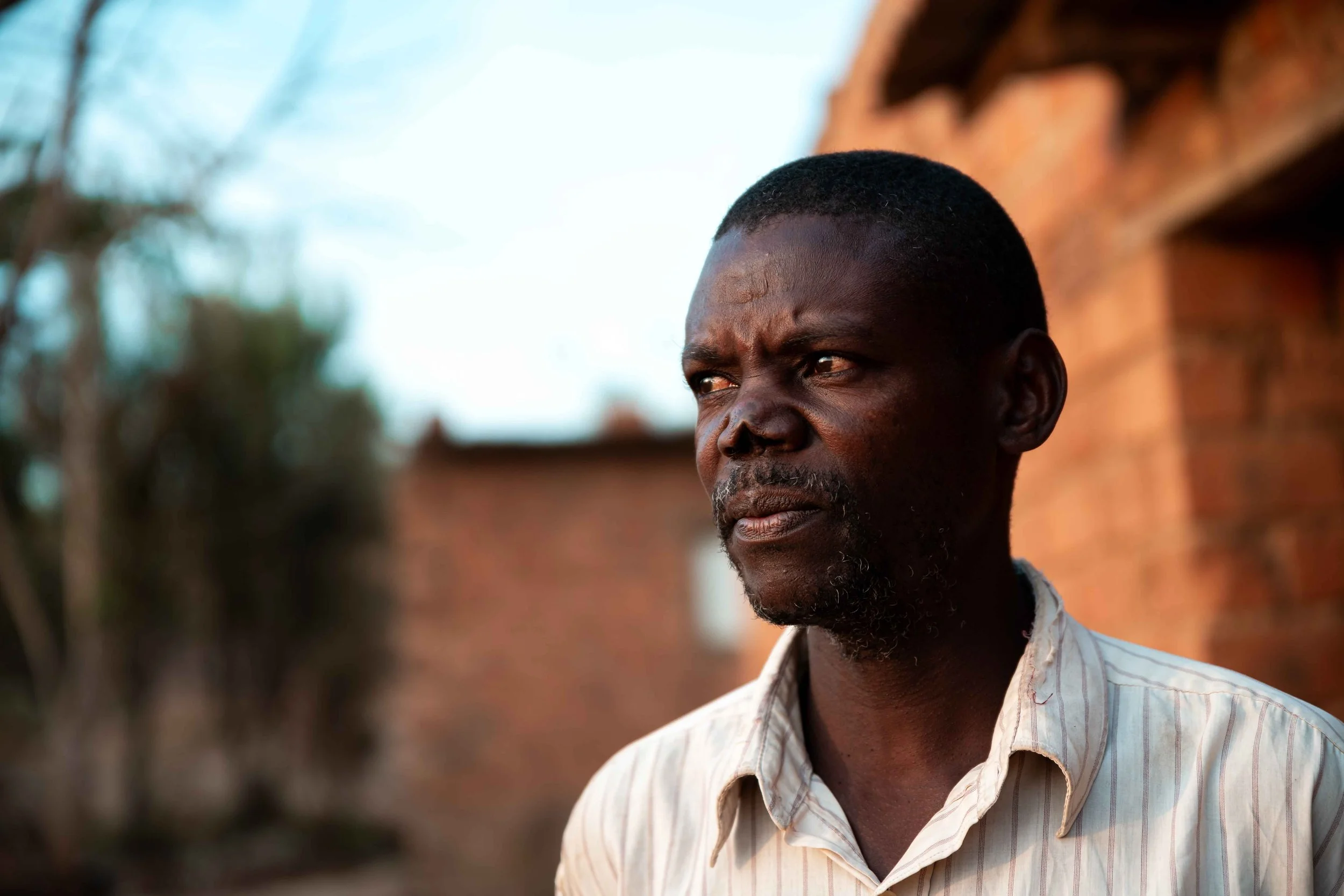 Portrait of Kalonda Augustin, 45, father of 11 children. Due to inadequate compensation for relocation, he is among those resisting displacement from the Manomapia neighborhood ordered by Tenke Fungurume Mining. Fungurume, Lualaba Province, Democrati