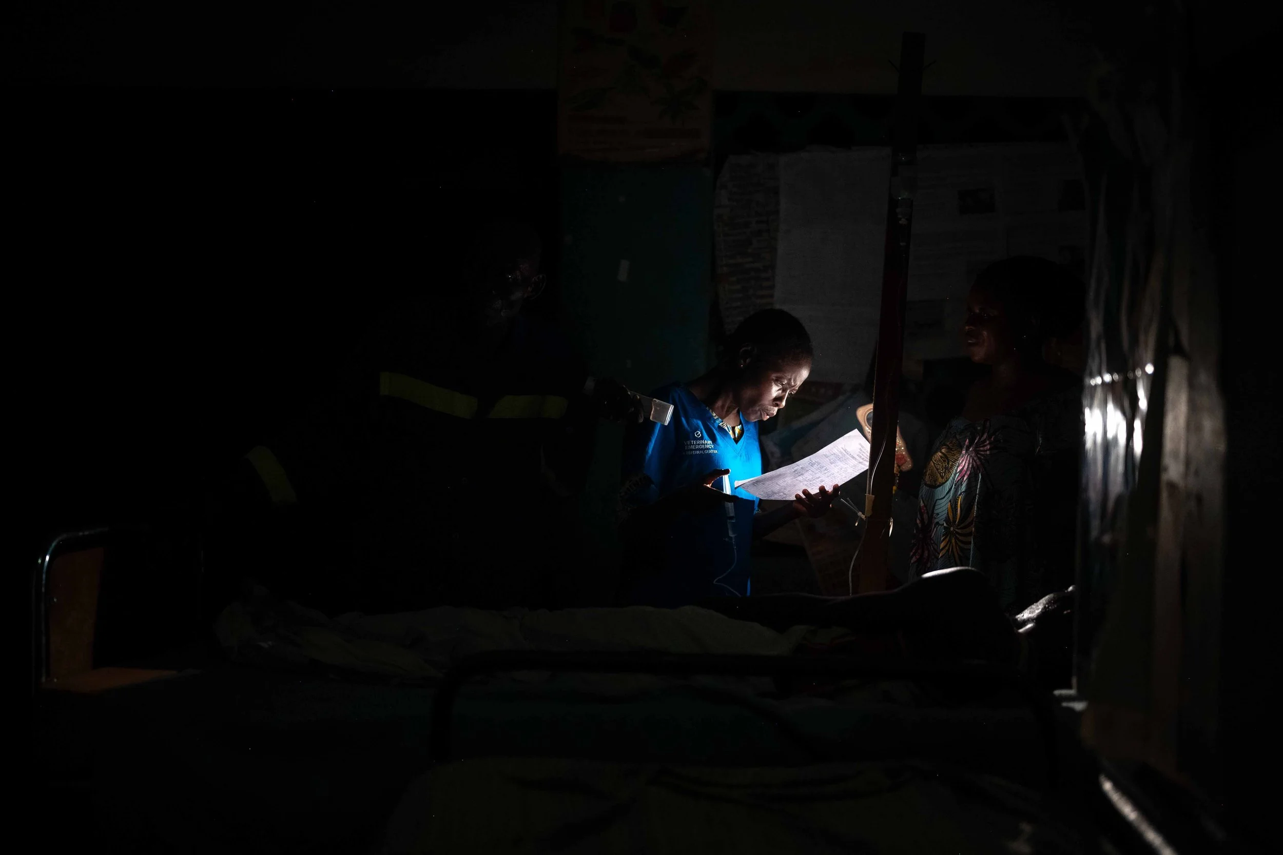Nighttime patient care at the Mukasa health center, in Kwilu, Democratic Republic of Congo, September 2025.