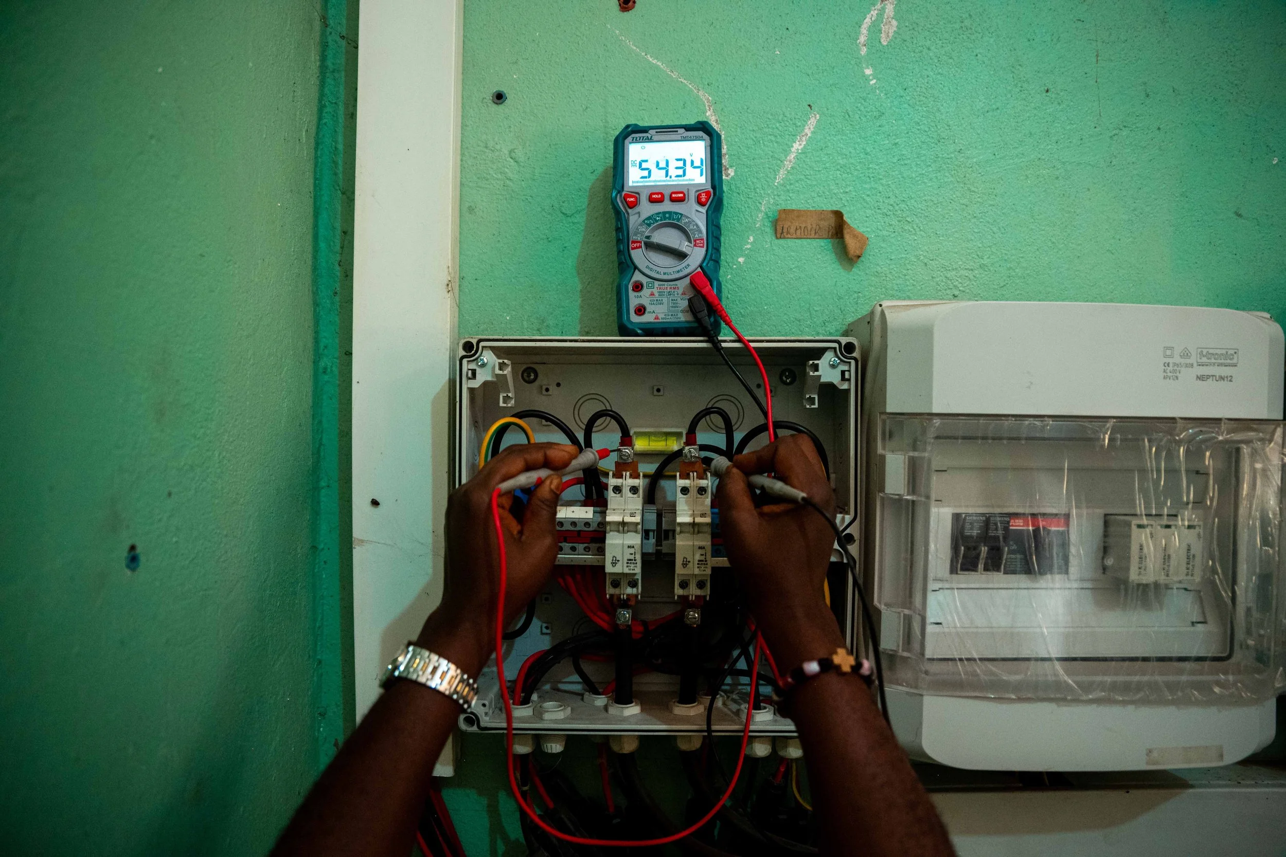 Sister Patience Katunda services the solar installations at the Paganoni health center, in Kwilu, Democratic Republic of Congo, September 2025.