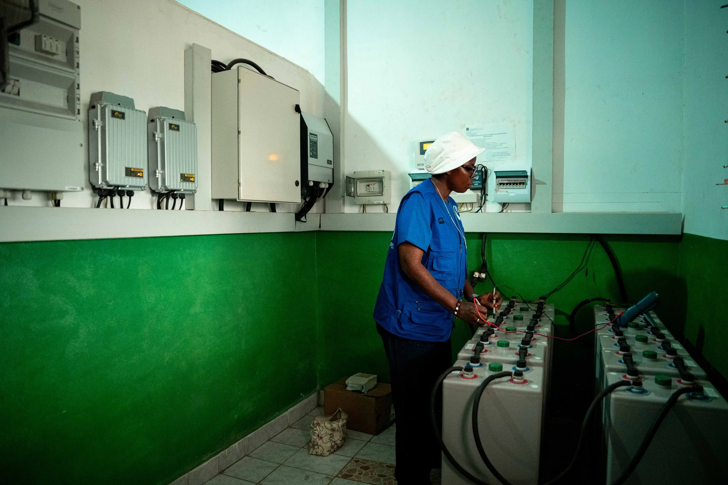 Sister Patience Katunda inspects the solar installations at the Louis Palazzolo health center, in Kwilu, Democratic Republic of Congo, September 2025.