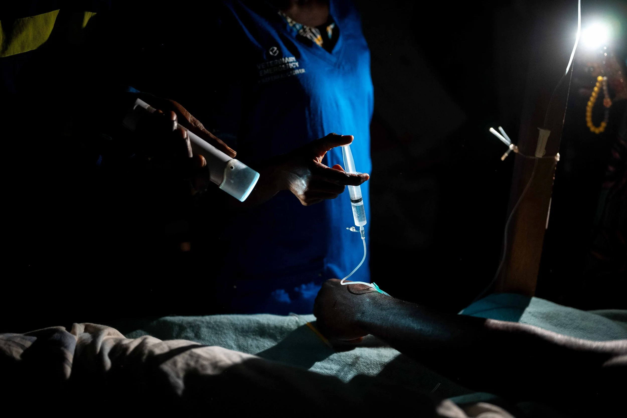 Nighttime patient care at the Mukasa health center, in Kwilu, Democratic Republic of Congo, September 2025.