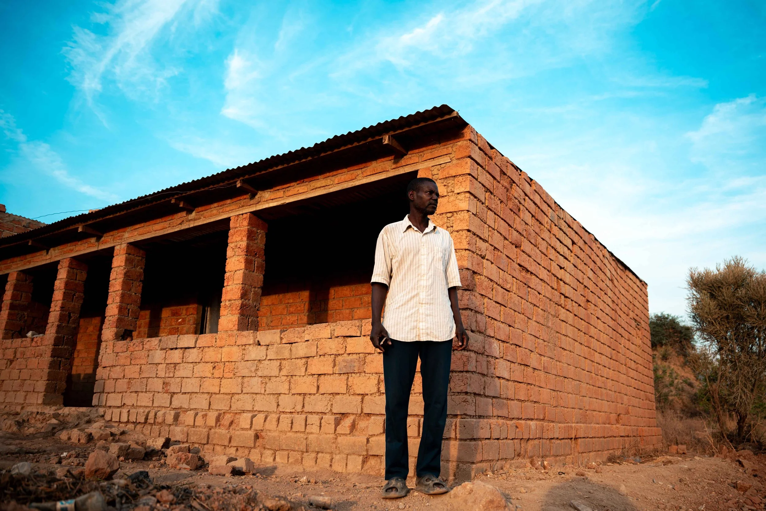 Portrait of Kalonda Augustin, 45, father of 11 children. Due to inadequate compensation for relocation, he is among those resisting displacement from the Manomapia neighborhood ordered by Tenke Fungurume Mining. Fungurume, Lualaba Province, Democrati