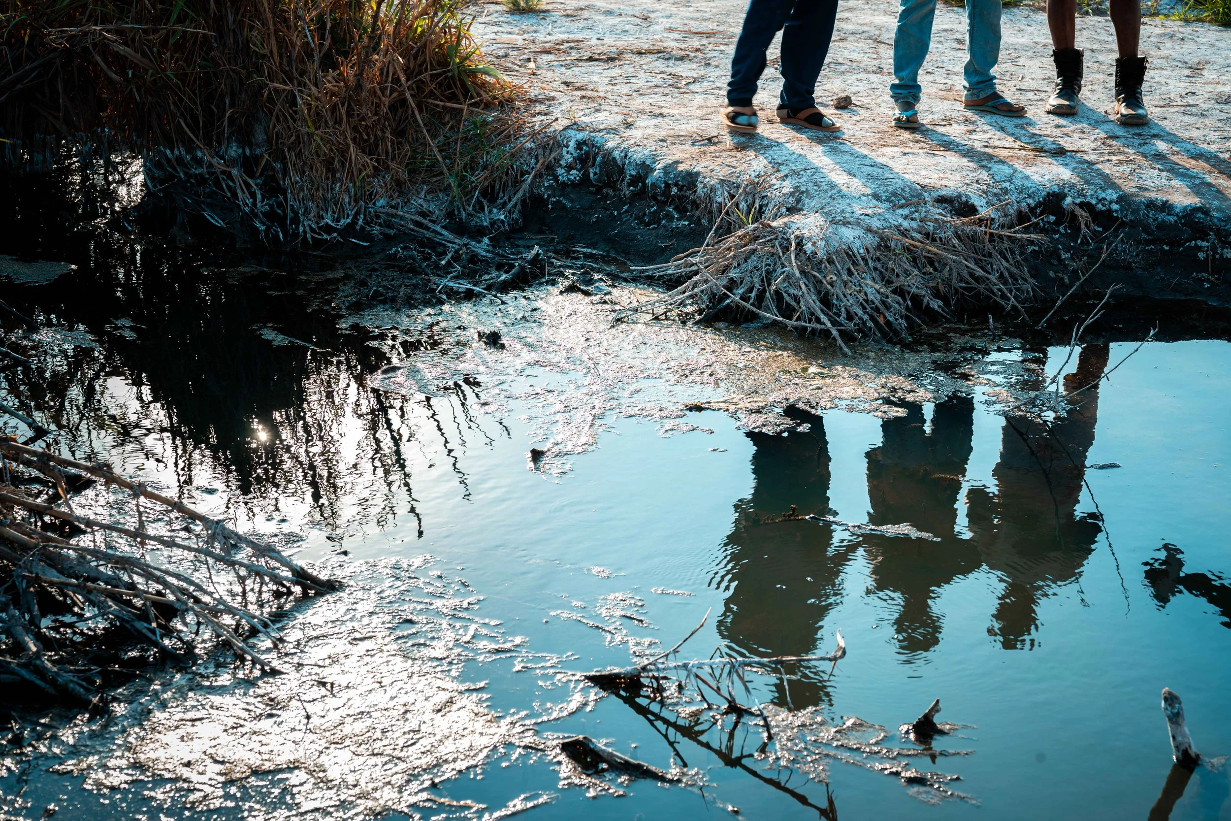 Signs of pollution along the river in Manomapia, Fungurume, Lualaba Province, Democratic Republic of the Congo.