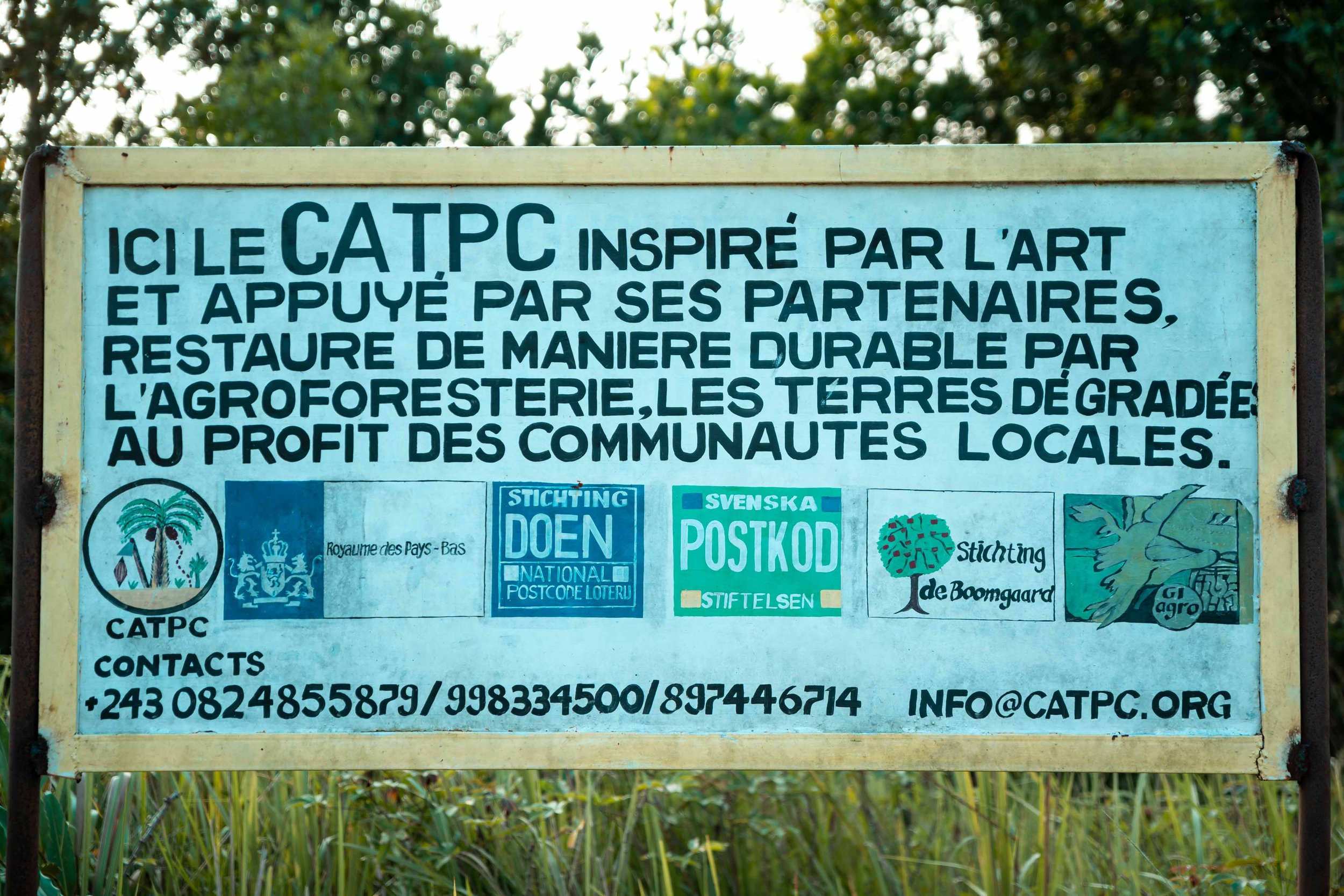 Sign at the CATPC reforestation site, listing the various partners. Lusanga, Democratic Republic of the Congo, February 2025.