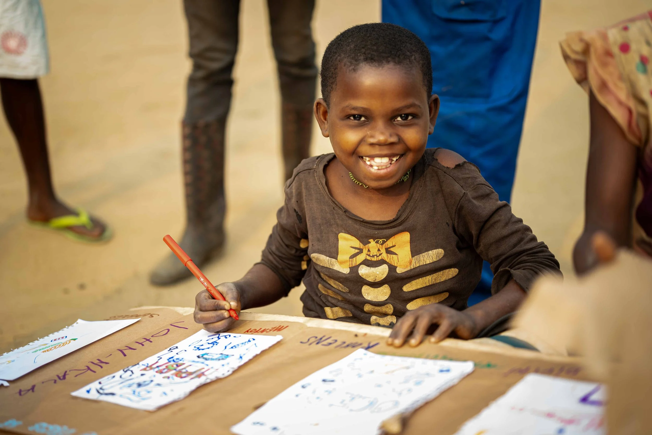 Monique Ngazala, 10, participates in creating a restitution poster for tourists at the end of their trip, Mai-Ndombe, Democratic Republic of Congo, August 2025.
