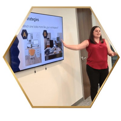 Krissy standing at a board giving a presentation