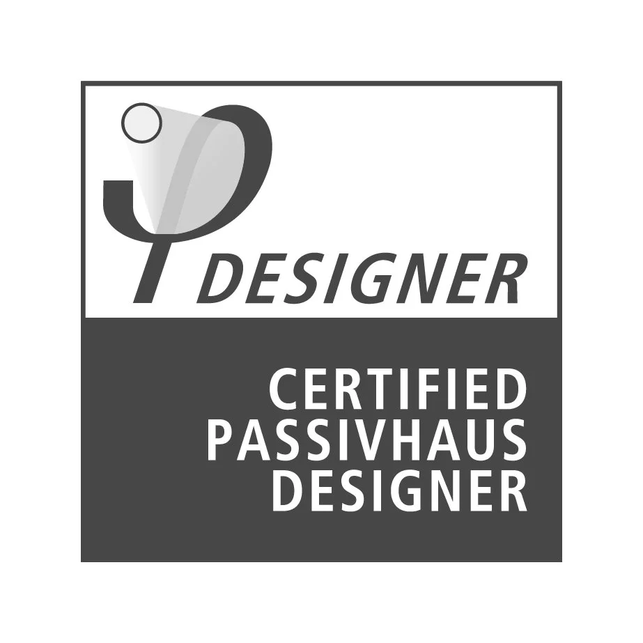 Black and white certification badge with a stethoscope icon that reads "Designer" and "Certified Passivhaus Designer".
